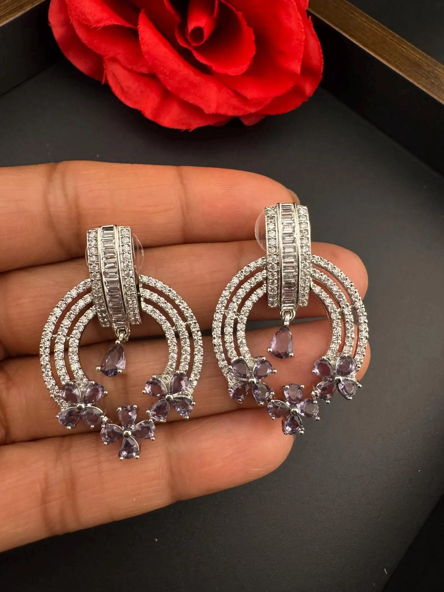 Premium earrings in Cubic Zirconia and Glass stone in silver color is designer Inspired Statement earrings