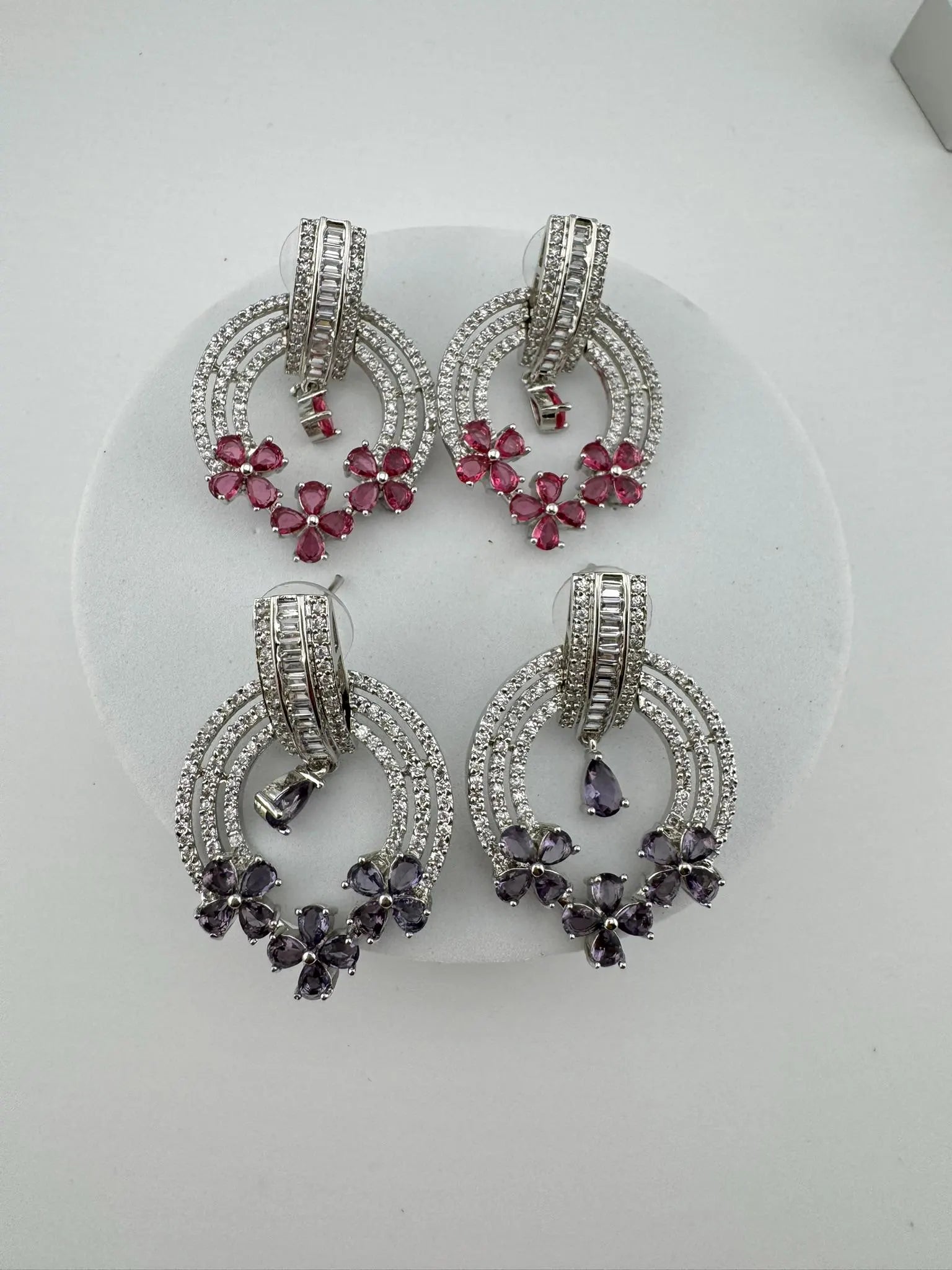 Premium earrings in Cubic Zirconia and Glass stone in silver color is designer Inspired Statement earrings