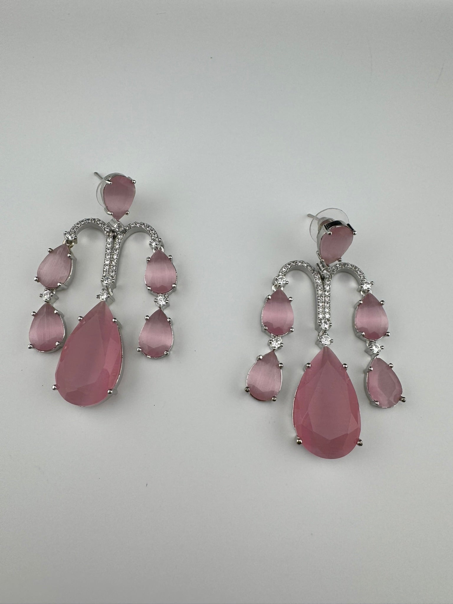 Premium Cubic Zirconia and glass stone in silver color is designer Inspired Statement Long earrings