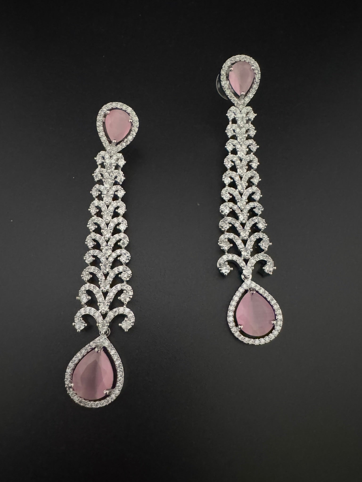Premium Cubic Zirconia and Crystal stone in silver color is designer Inspired Statement Long earrings