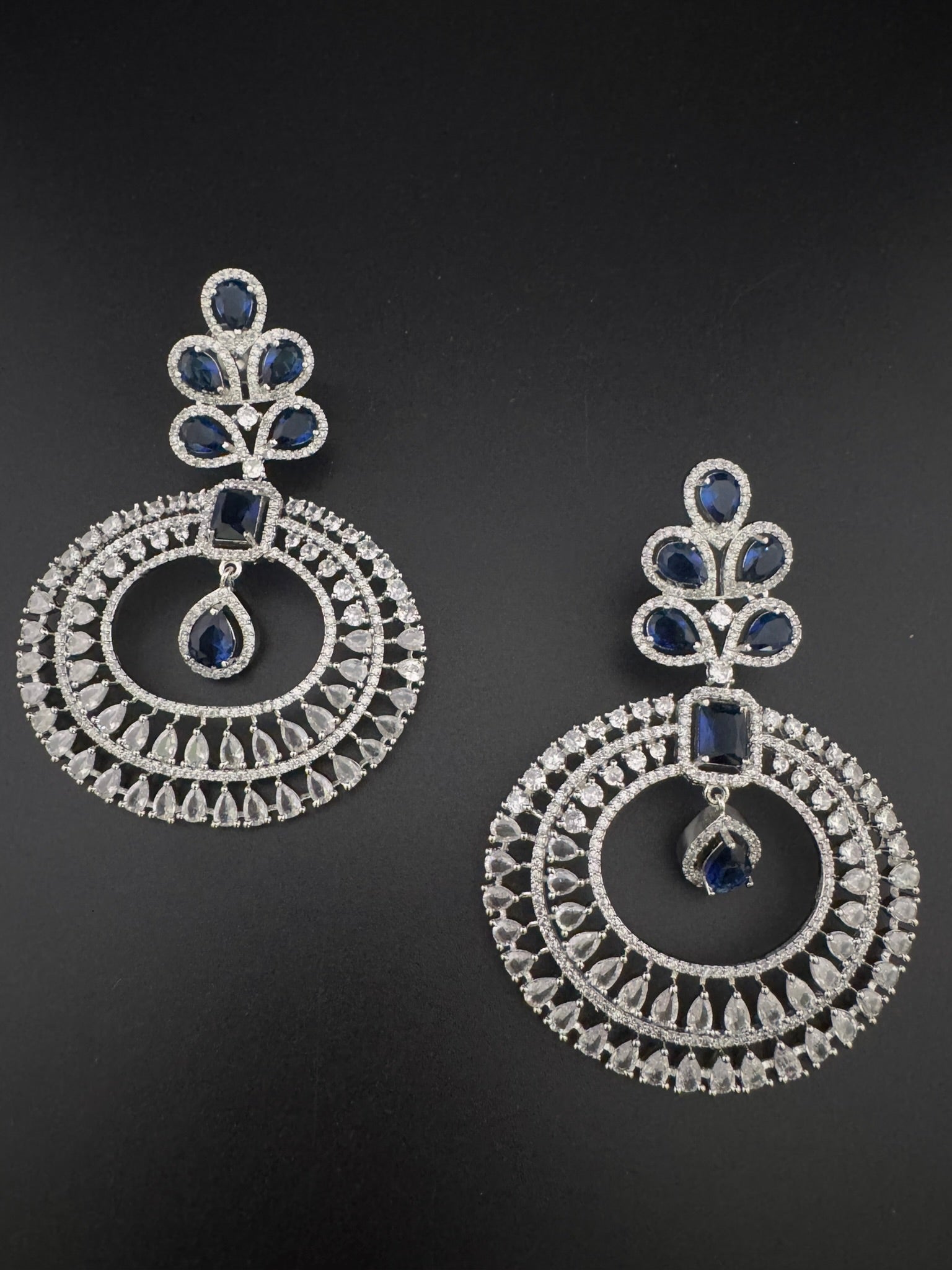 Premium Cubic Zirconia Oversized Chandelier earrings in stones in silver color is designer Inspired Long Statement earrings