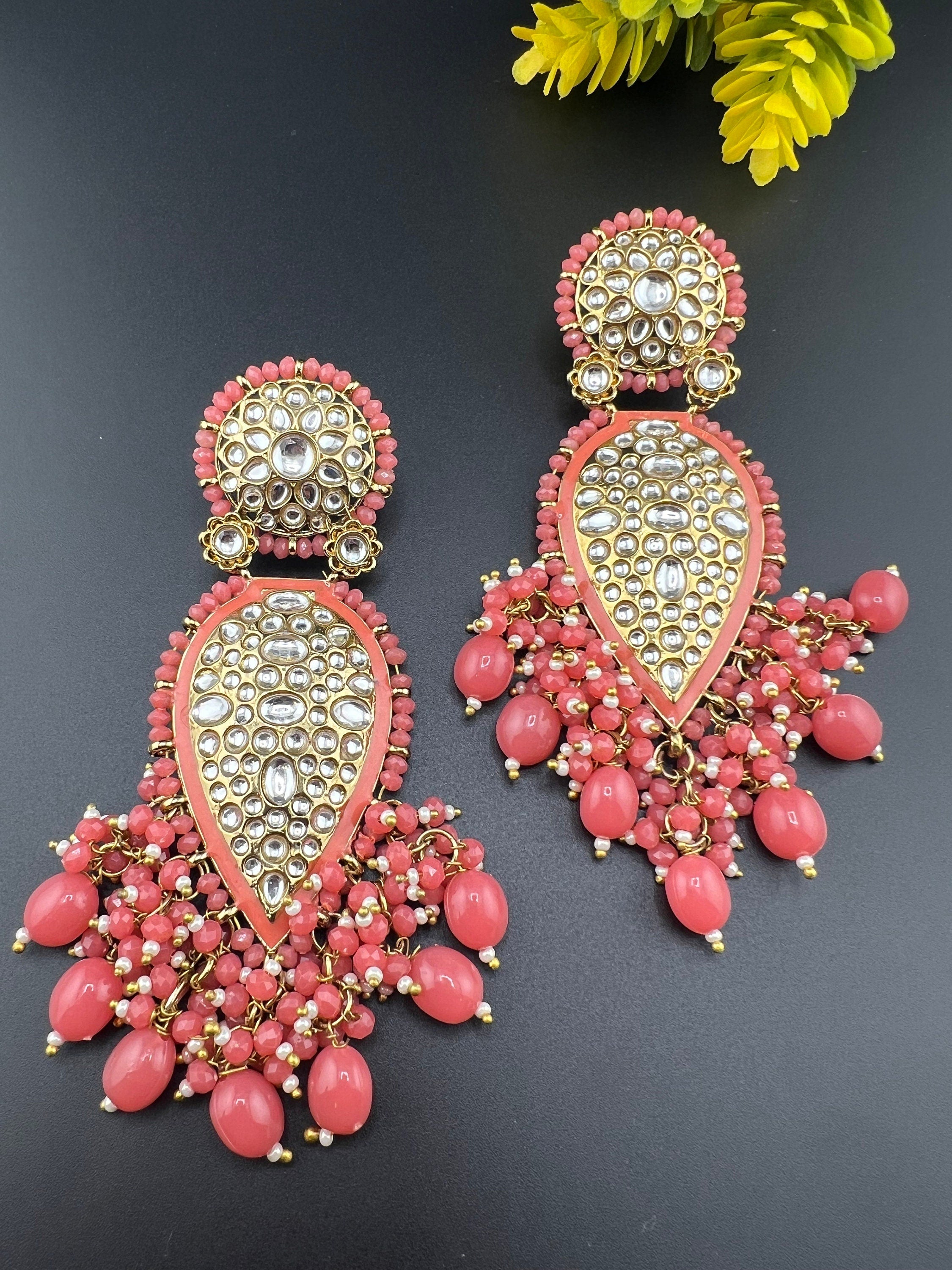 Exquisite detailed Gold and Coral color long Chand Bali Earrings with kundan and pearls