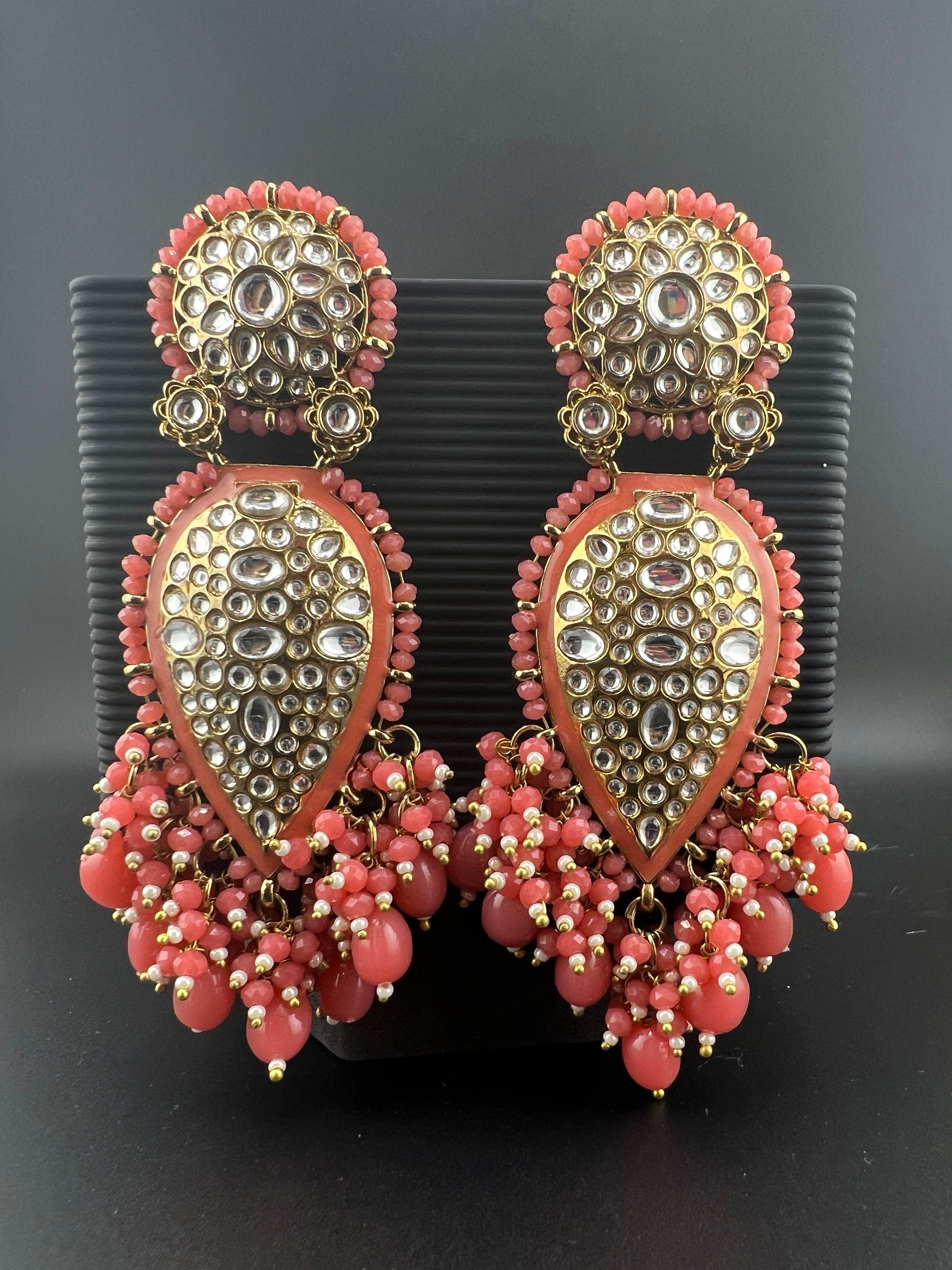 Exquisite detailed Gold and Coral color long Chand Bali Earrings with kundan and pearls