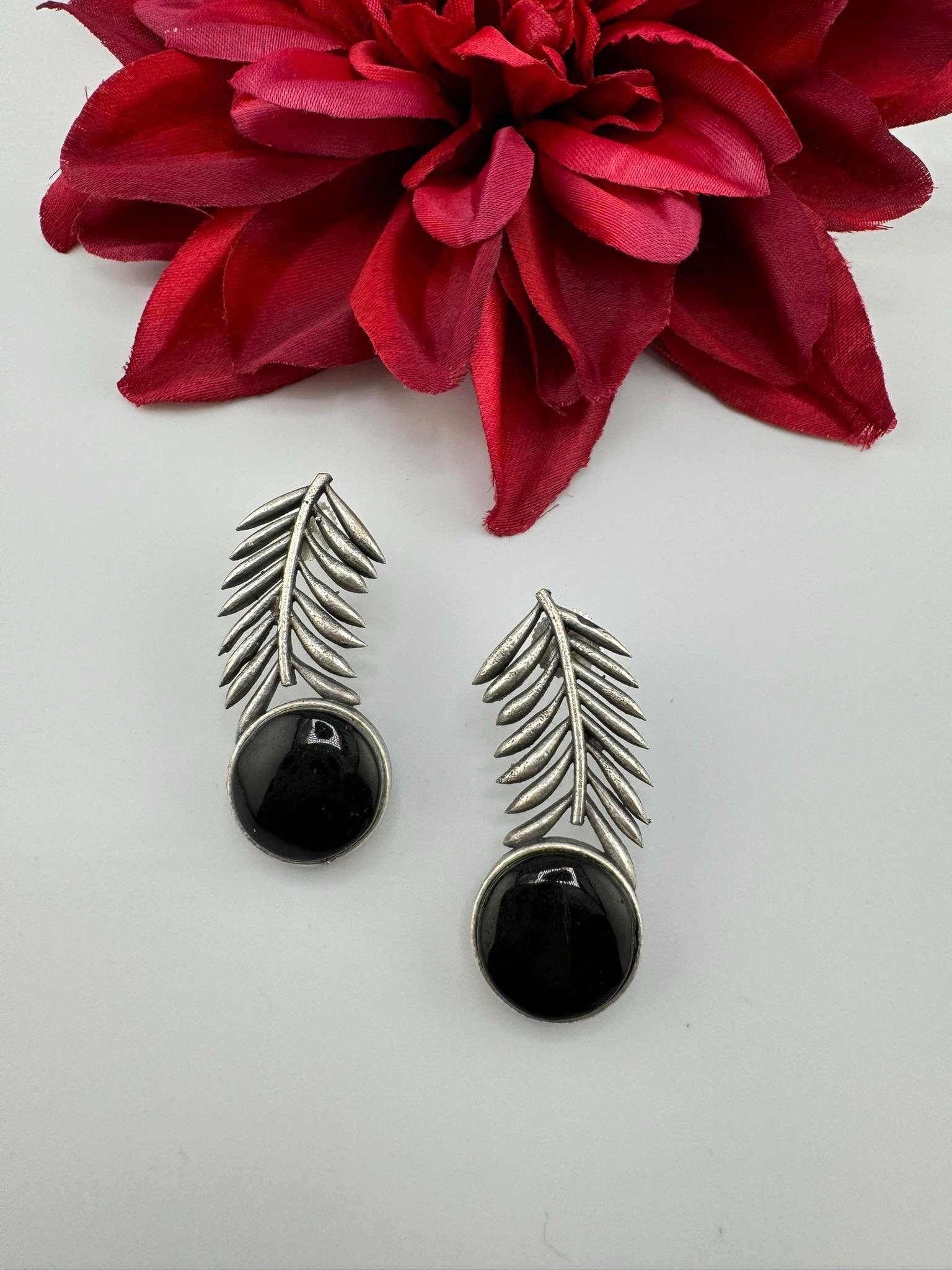 Oxidized German silver leaf pattern Stud earrings with Monalisa stone