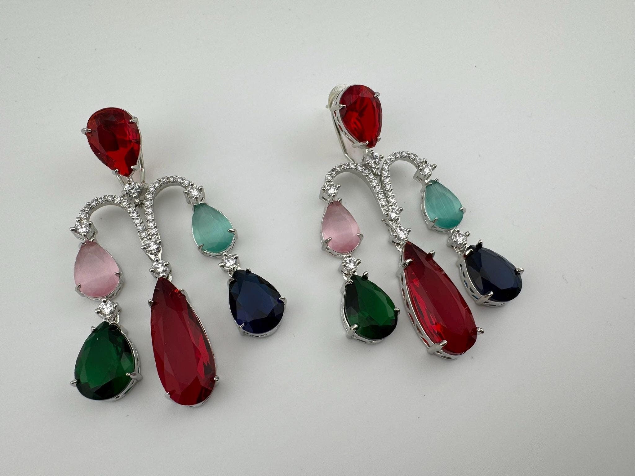 Premium Cubic Zirconia and glass stone in silver color is designer Inspired Statement Long earrings
