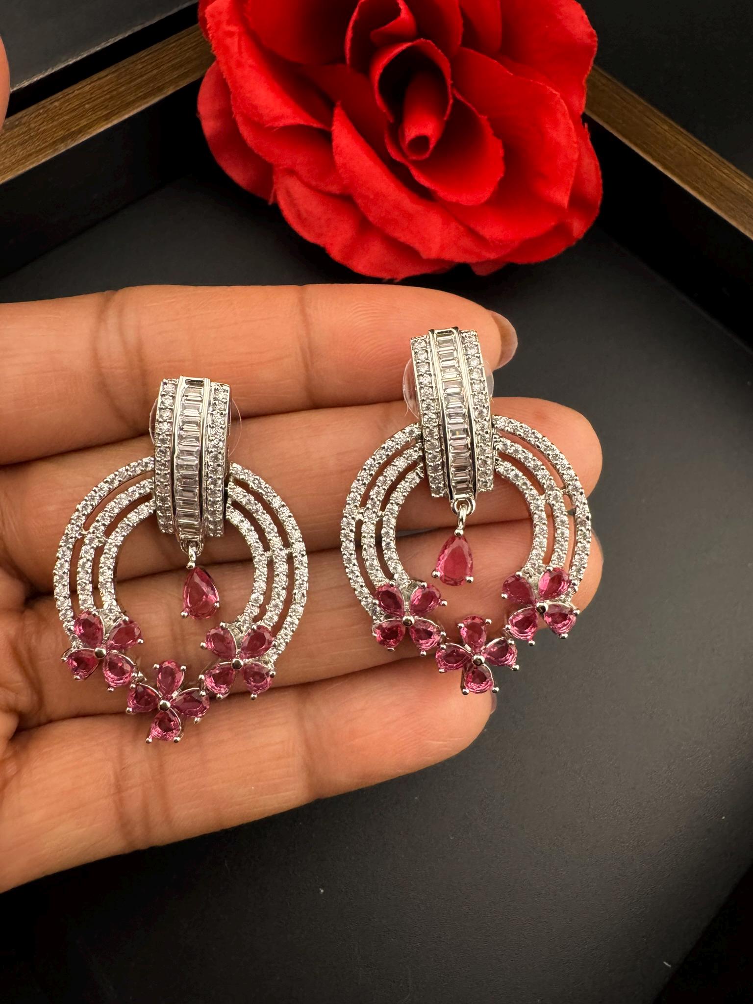 Premium earrings in Cubic Zirconia and Glass stone in silver color is designer Inspired Statement earrings