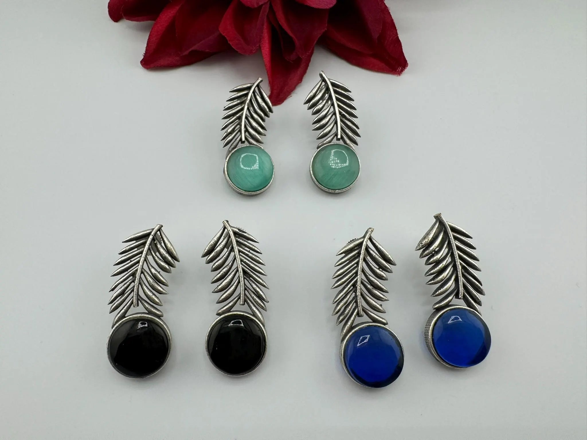 Oxidized German silver leaf pattern Stud earrings with Monalisa stone