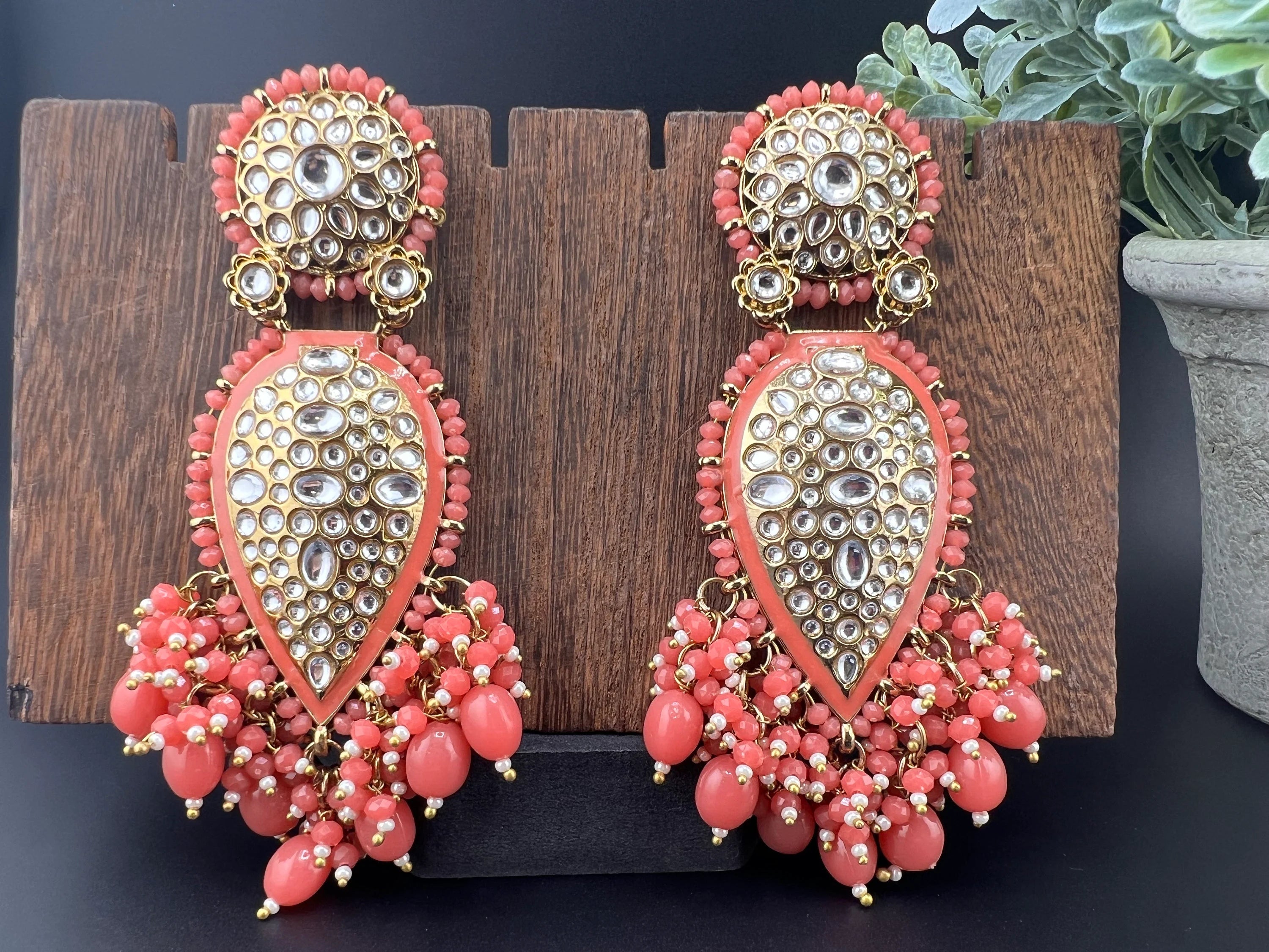 Exquisite detailed Gold and Coral color long Chand Bali Earrings with kundan and pearls