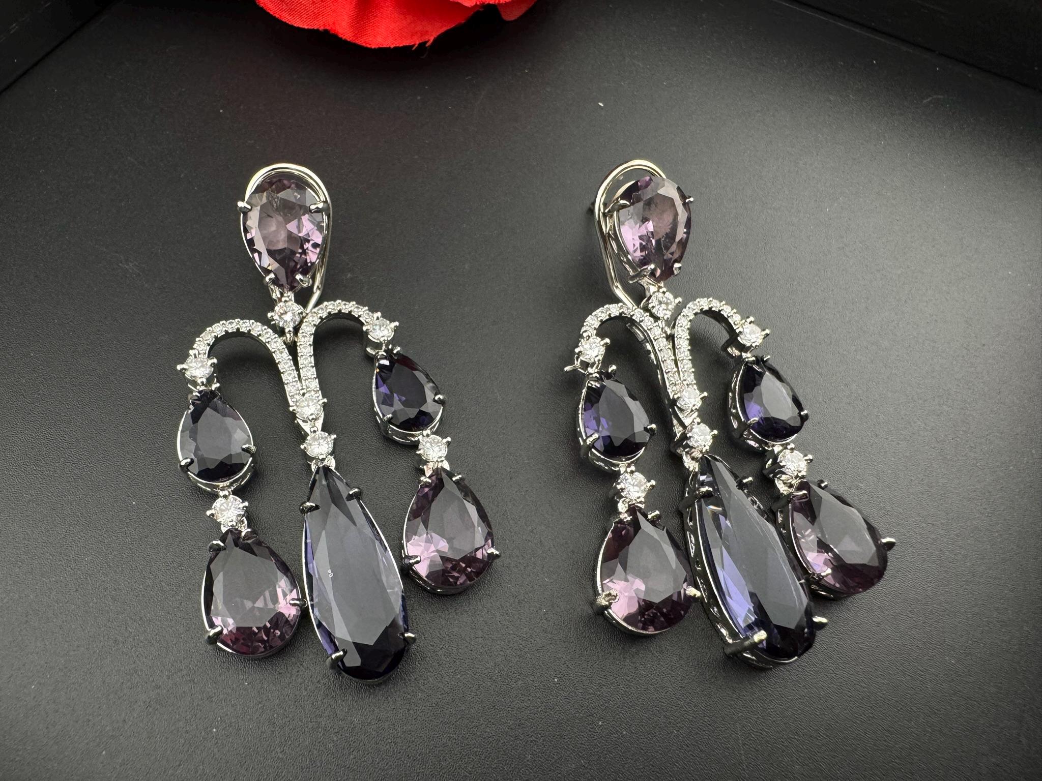 Premium Cubic Zirconia and glass stone in silver color is designer Inspired Statement Long earrings