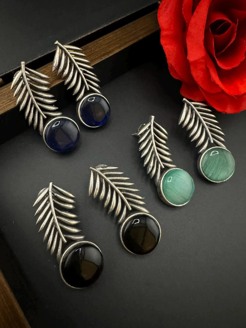 Oxidized German silver leaf pattern Stud earrings with Monalisa stone