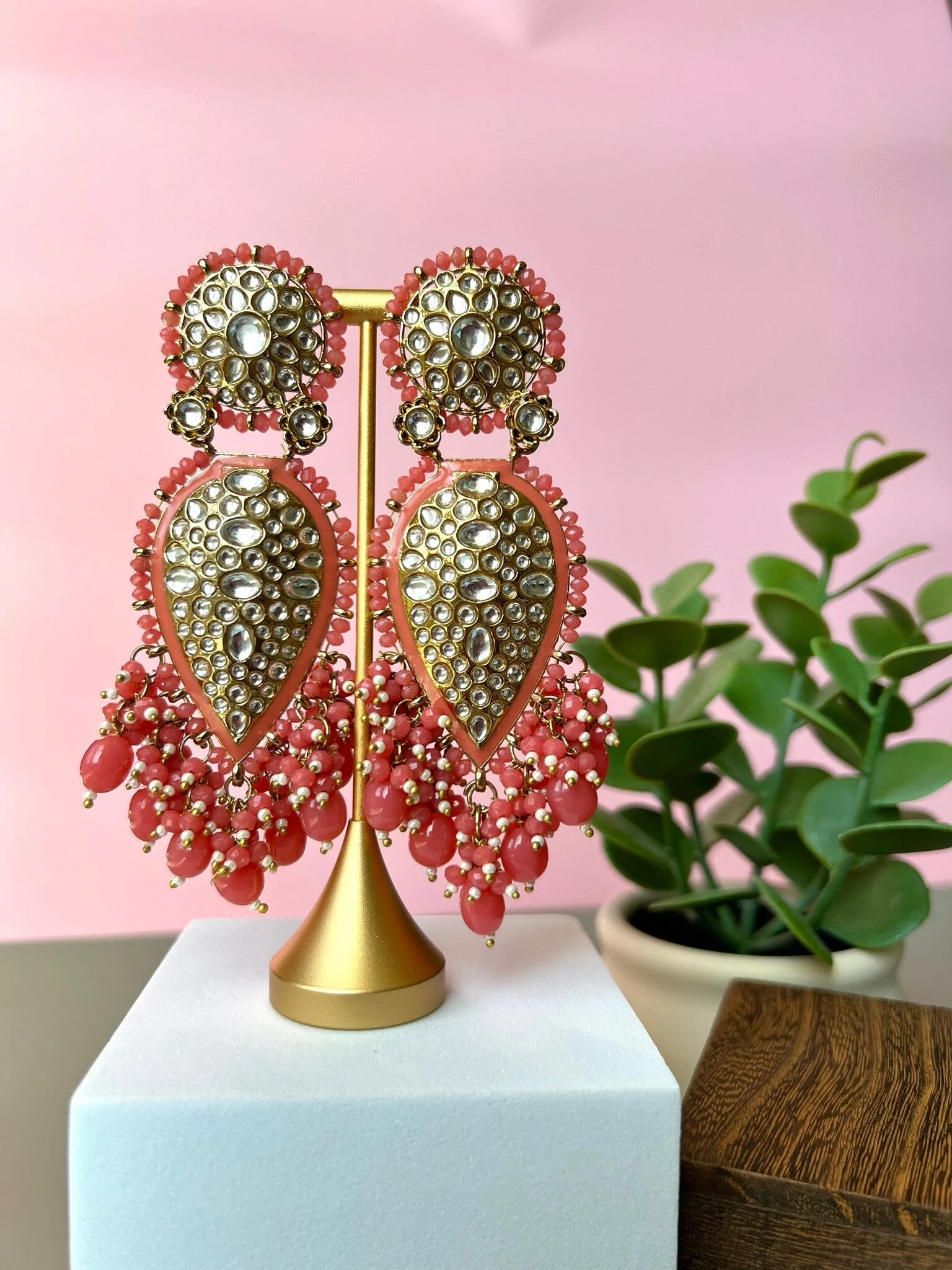 Exquisite detailed Gold and Coral color long Chand Bali Earrings with kundan and pearls