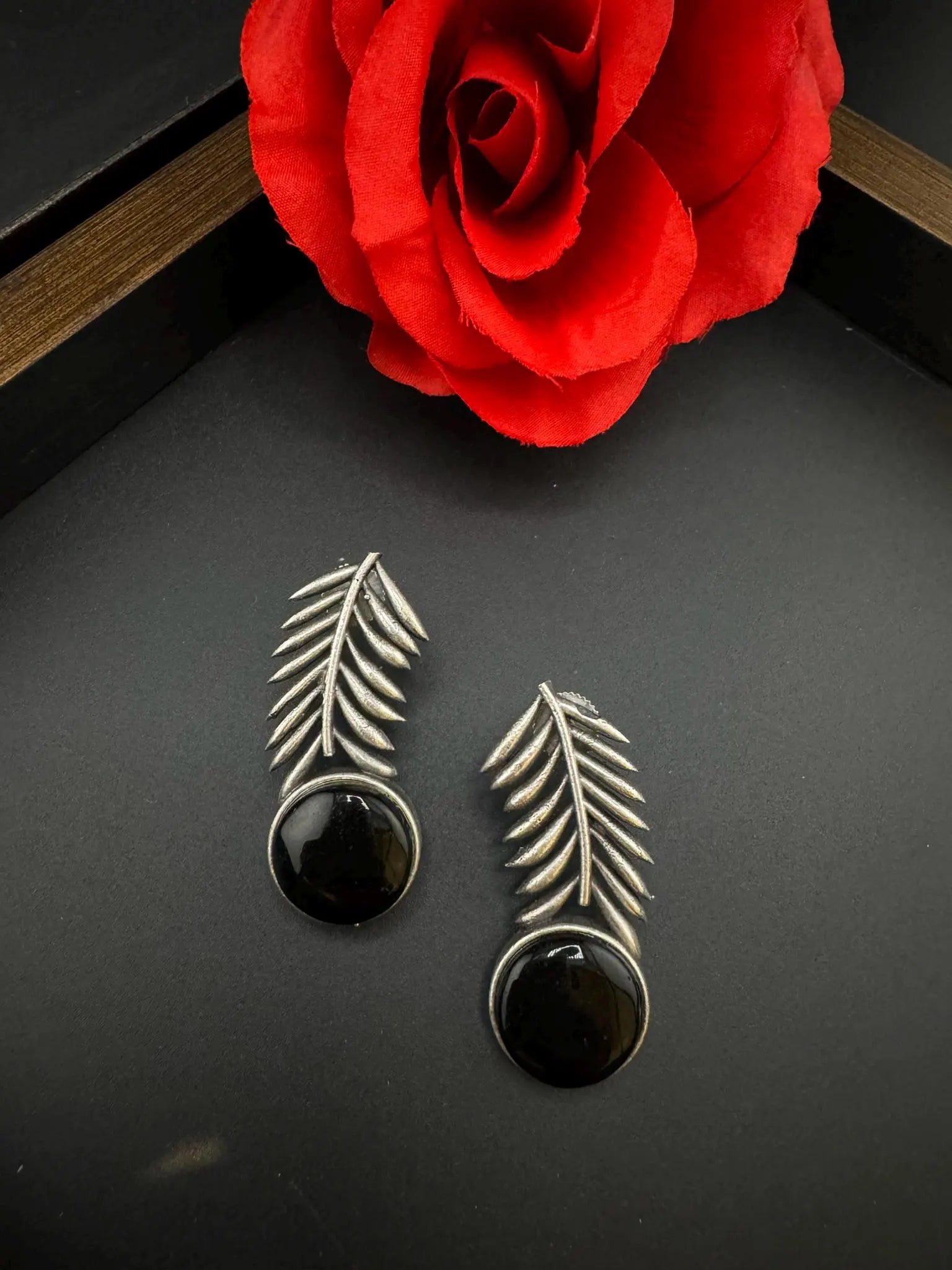 Oxidized German silver leaf pattern Stud earrings with Monalisa stone