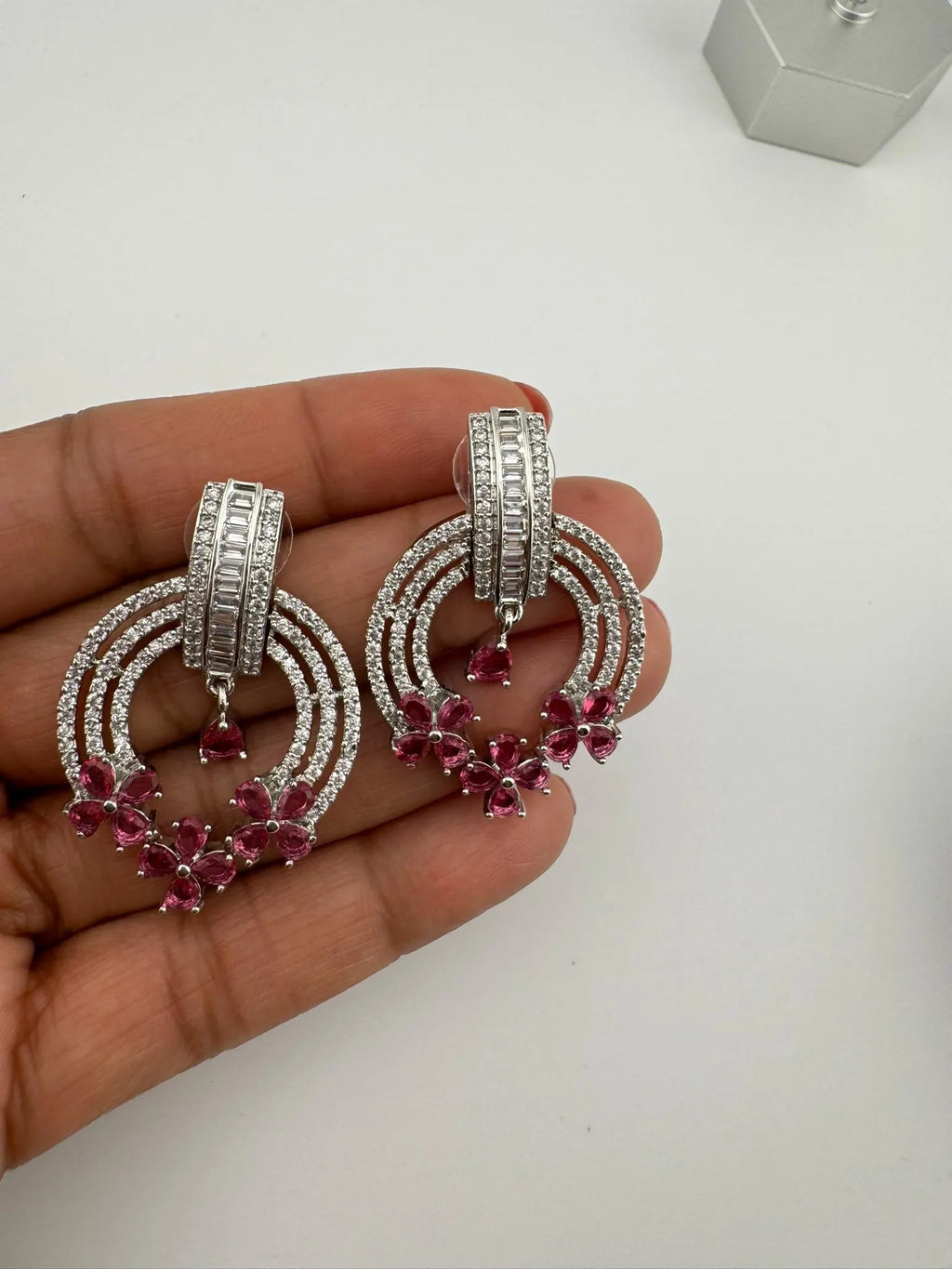 Premium earrings in Cubic Zirconia and Glass stone in silver color is designer Inspired Statement earrings