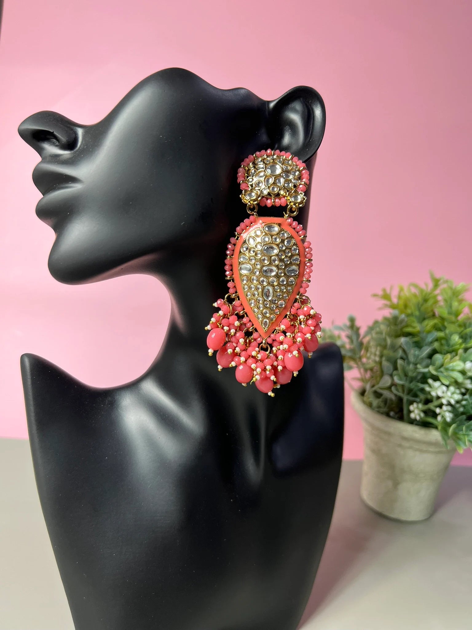 Exquisite detailed Gold and Coral color long Chand Bali Earrings with kundan and pearls