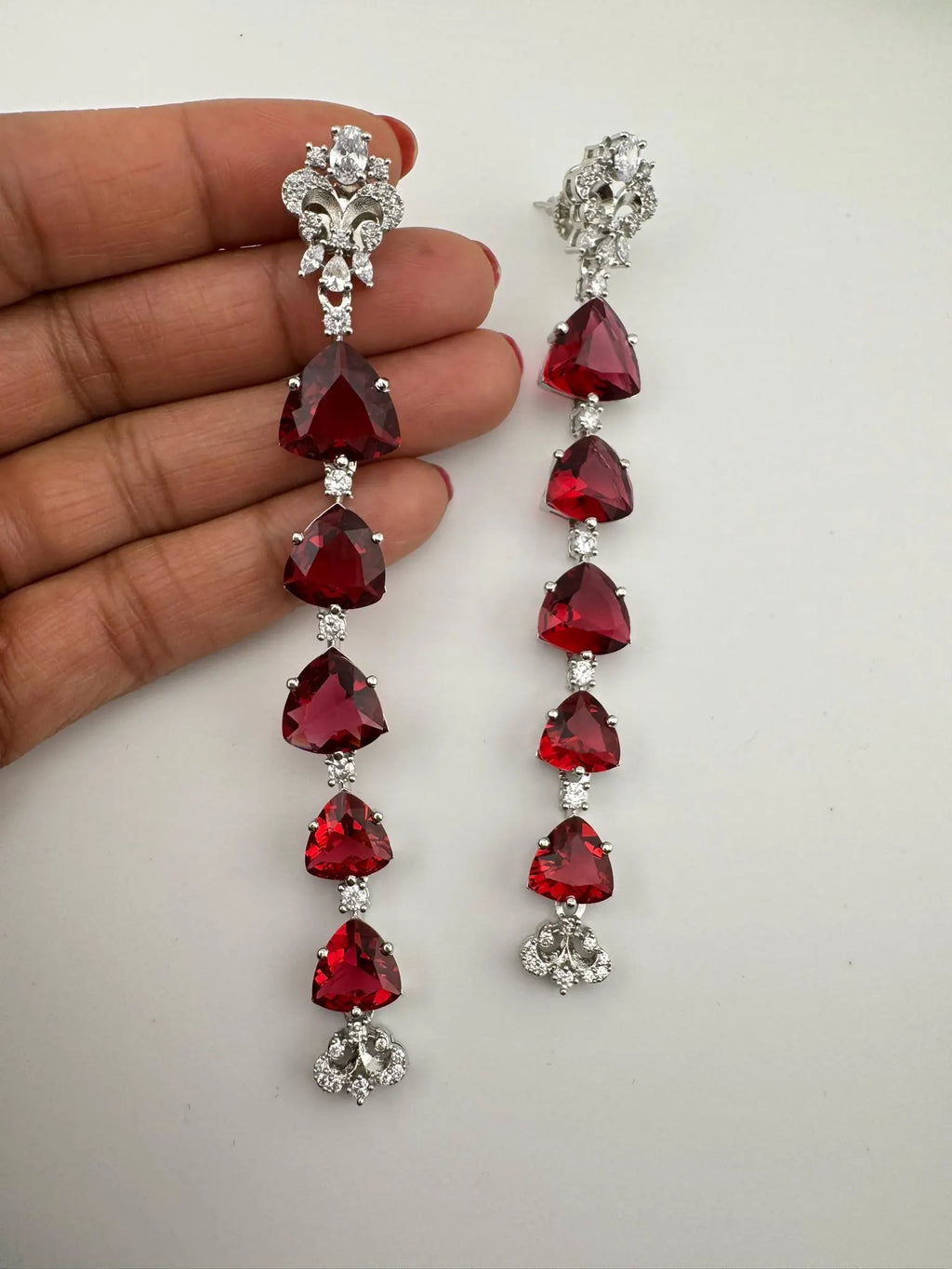 Premium Cubic Zirconia and glass stone in silver color is designer Inspired Statement Long earrings