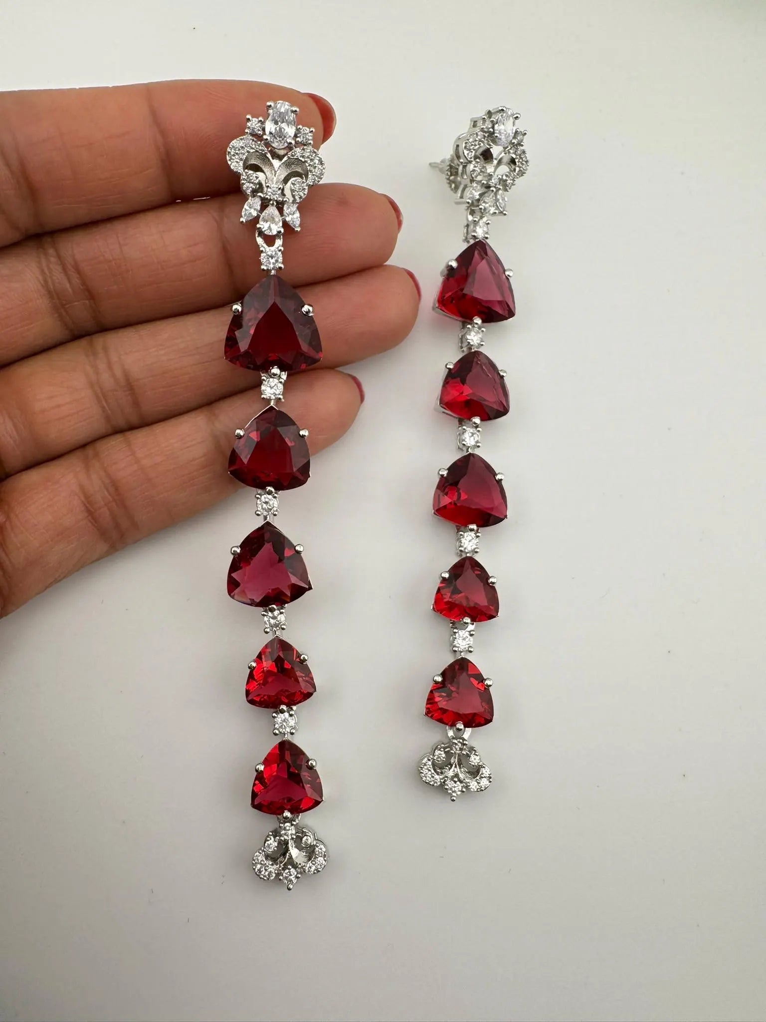 Premium Cubic Zirconia and glass stone in silver color is designer Inspired Statement Long earrings