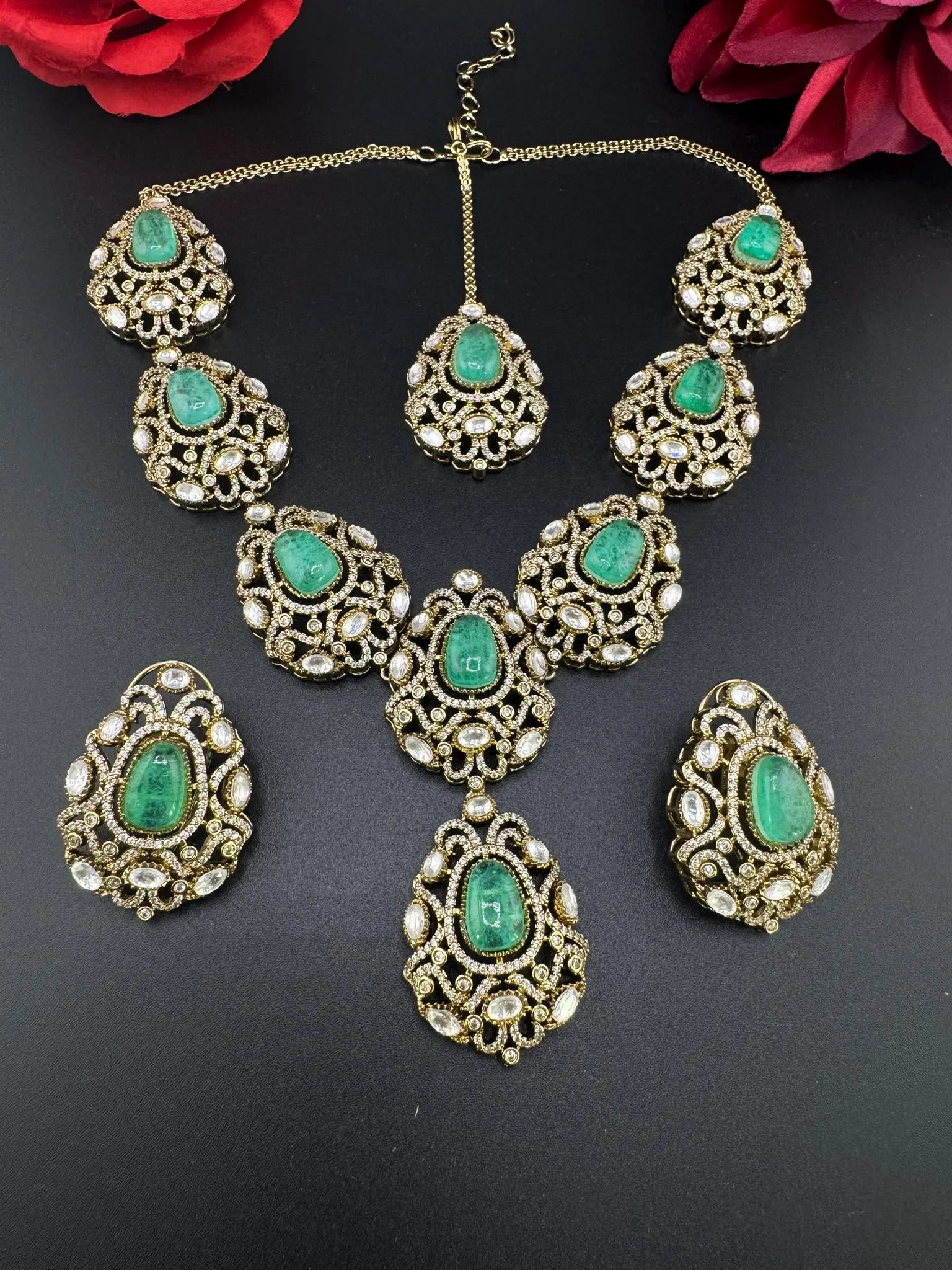 Premium Quality in Moissanite, uncut Kundan, CZ, Doublet stones in matt gold is Designer inspired fusion Necklace with Stud earring & Tikka