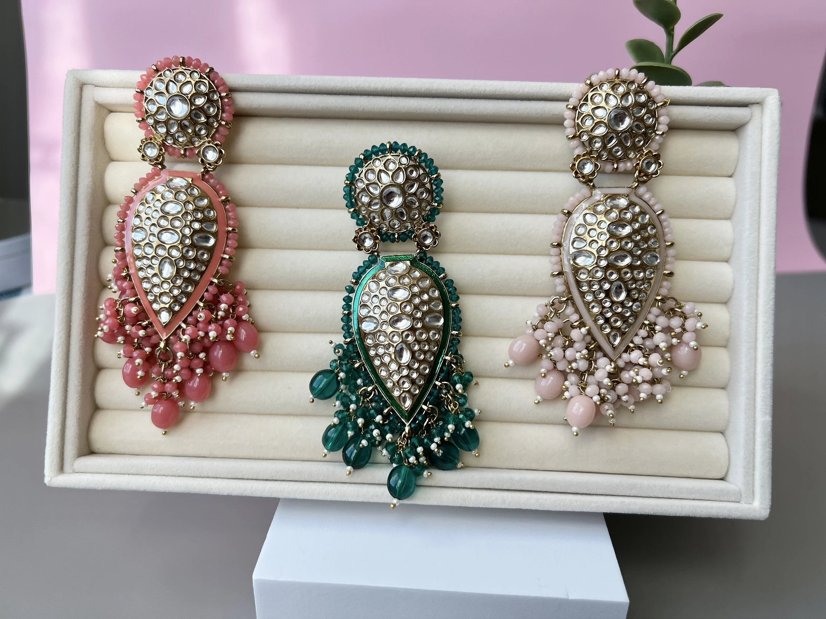 Exquisite detailed Gold and Coral color long Chand Bali Earrings with kundan and pearls