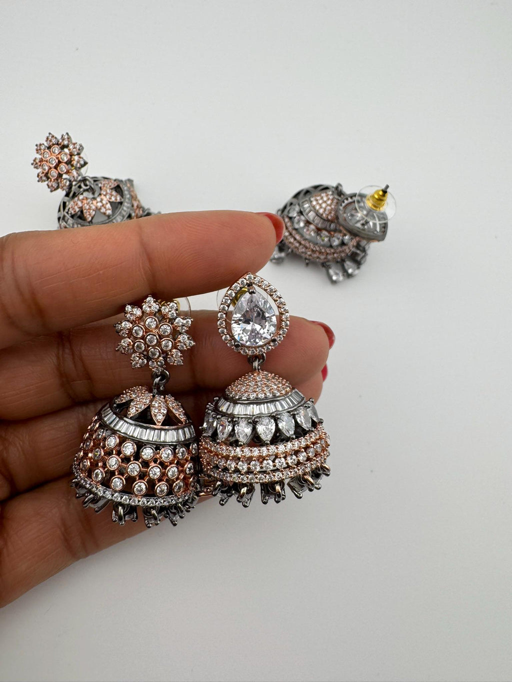 Premium Victorian Polish and  Rose Gold color Jhumka with Cubic Zirconia in unique setting