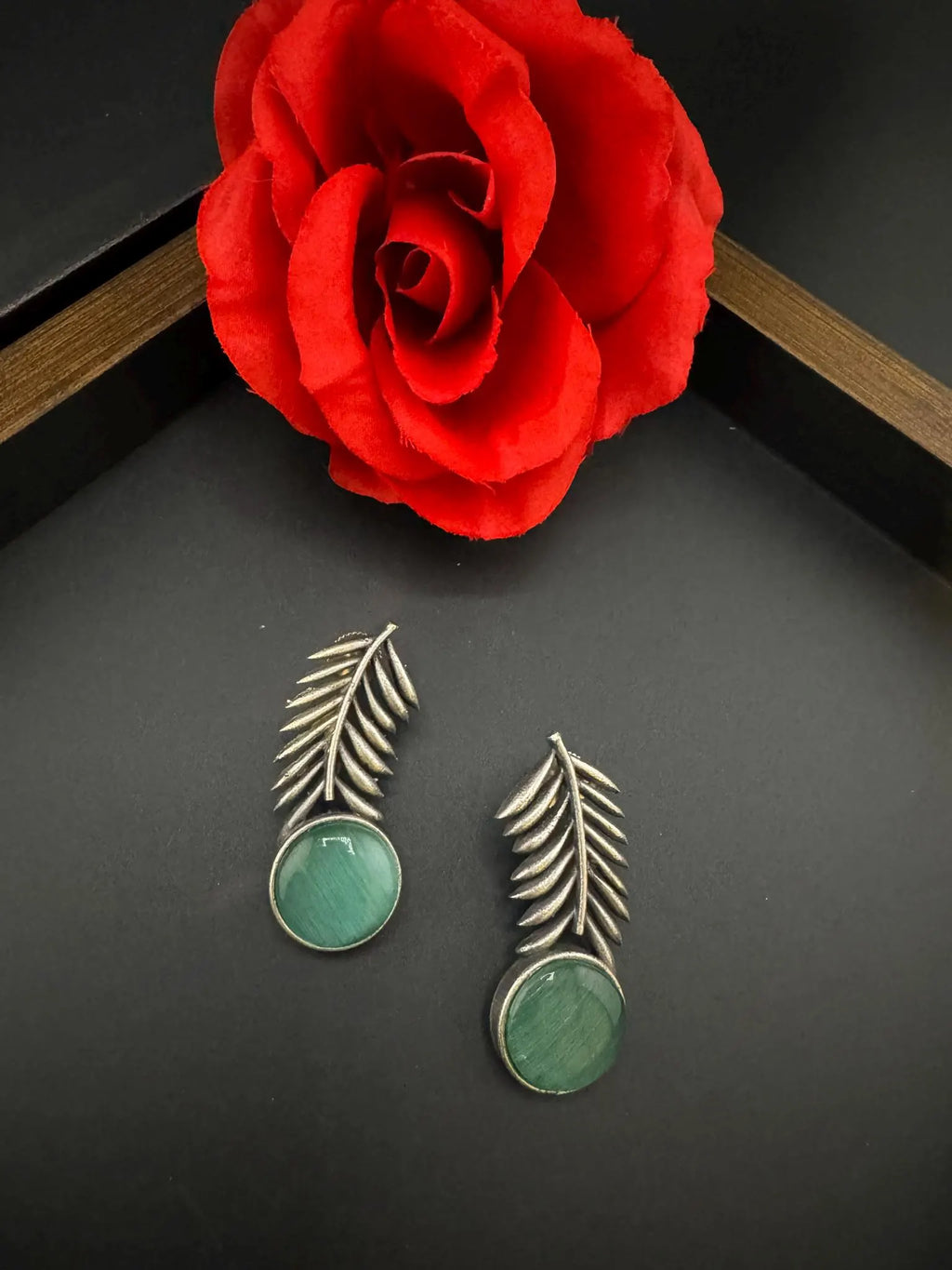 Oxidized German silver leaf pattern Stud earrings with Monalisa stone