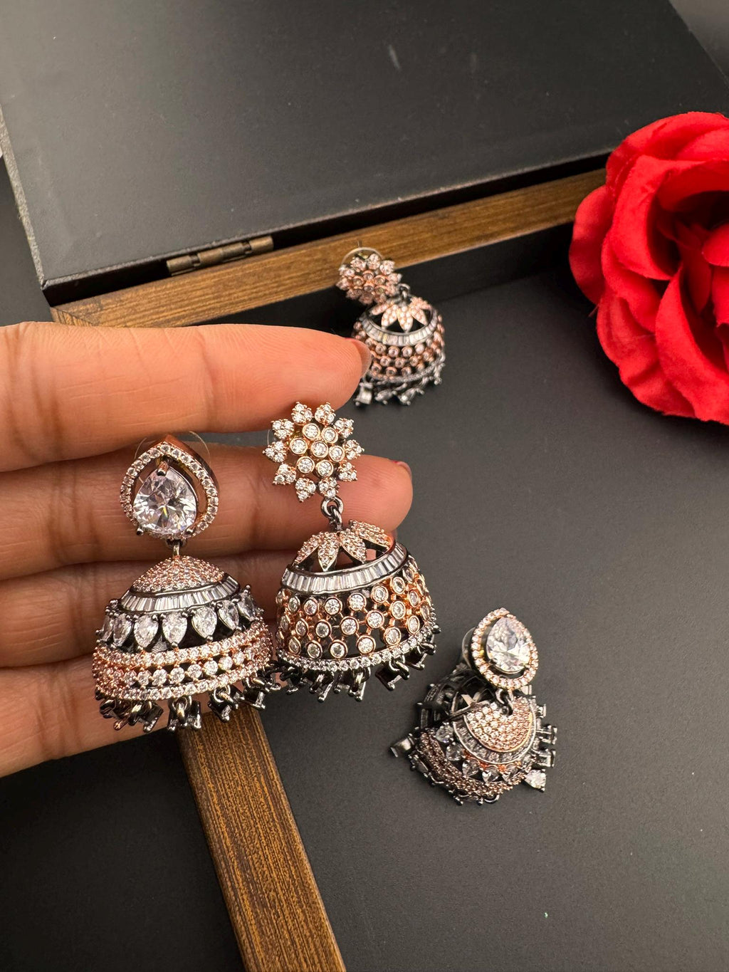 Premium Victorian Polish and  Rose Gold color Jhumka with Cubic Zirconia in unique setting