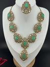 Premium Quality in Moissanite, uncut Kundan, CZ, Doublet stones in matt gold is Designer inspired fusion Necklace with Stud earring & Tikka