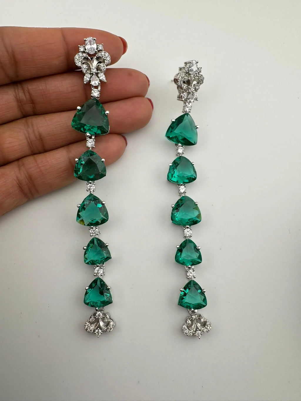Premium Cubic Zirconia and glass stone in silver color is designer Inspired Statement Long earrings