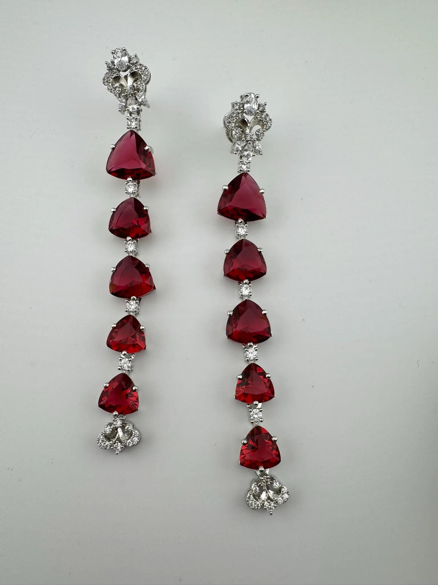 Premium Cubic Zirconia and glass stone in silver color is designer Inspired Statement Long earrings