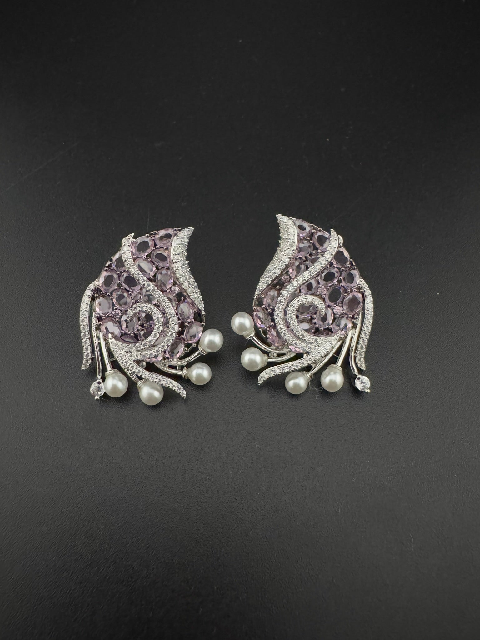 Premium Nano Setting Cubic Zirconia, Crystal stones in Unique setting is designer Inspired Statement Silver colored Stud earrings