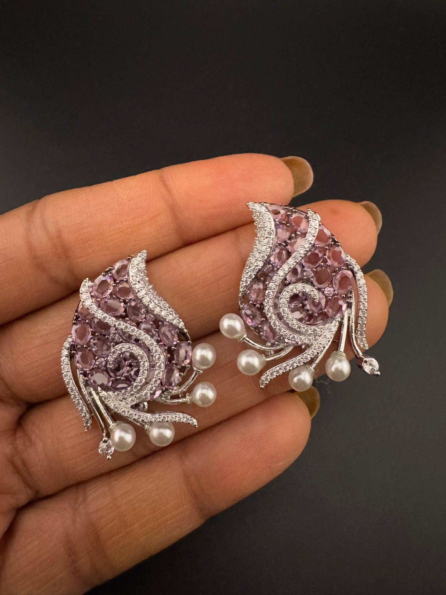 Premium Nano Setting Cubic Zirconia, Crystal stones in Unique setting is designer Inspired Statement Silver colored Stud earrings