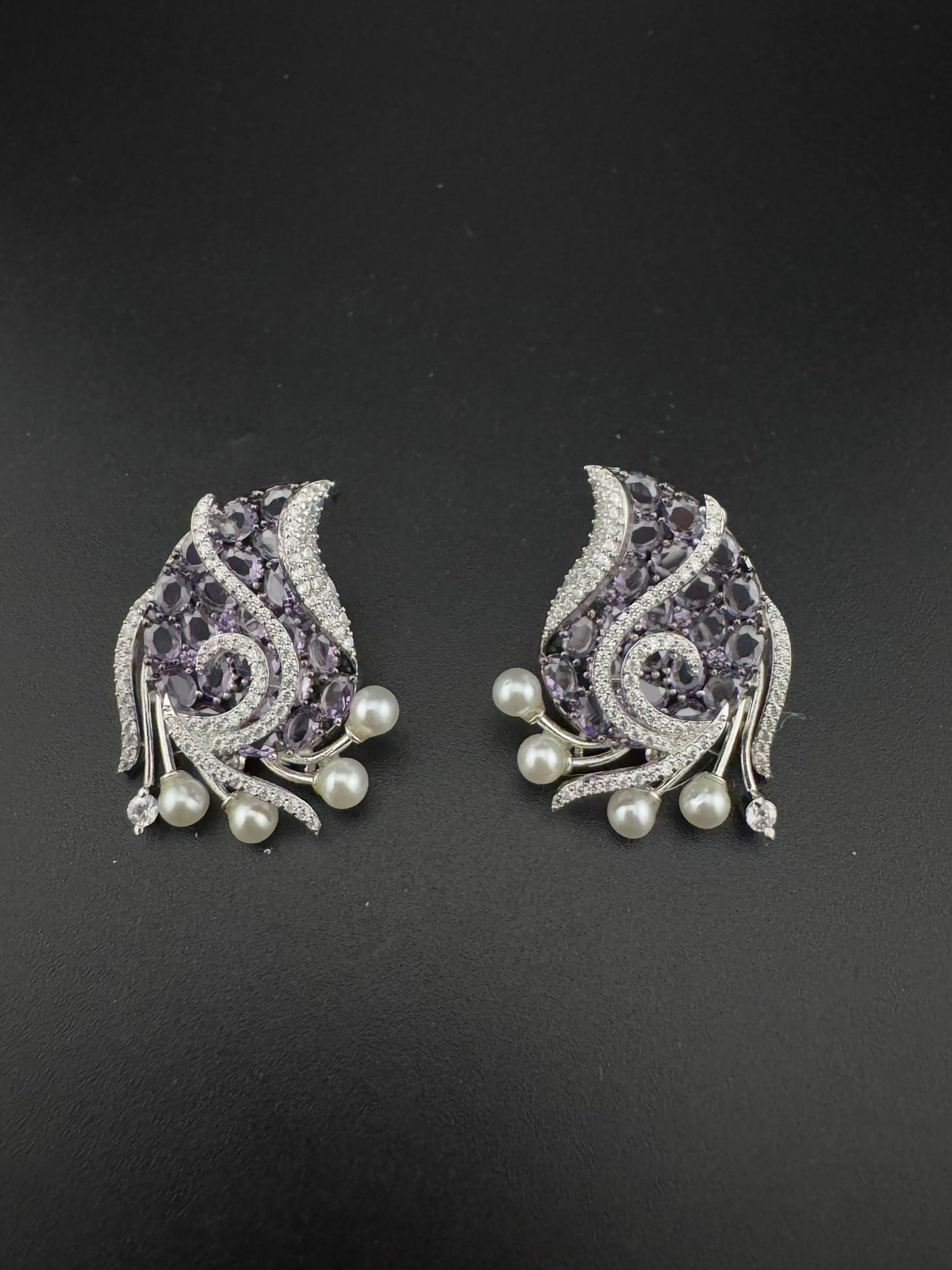 Premium Nano Setting Cubic Zirconia, Crystal stones in Unique setting is designer Inspired Statement Silver colored Stud earrings