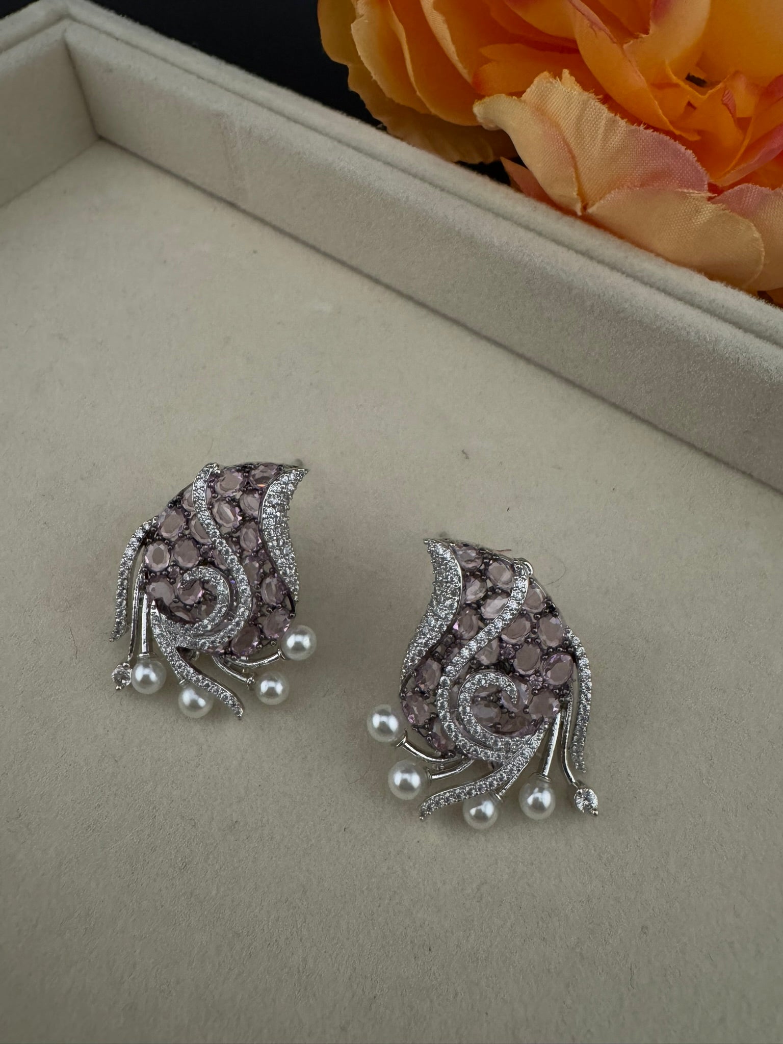 Premium Nano Setting Cubic Zirconia, Crystal stones in Unique setting is designer Inspired Statement Silver colored Stud earrings