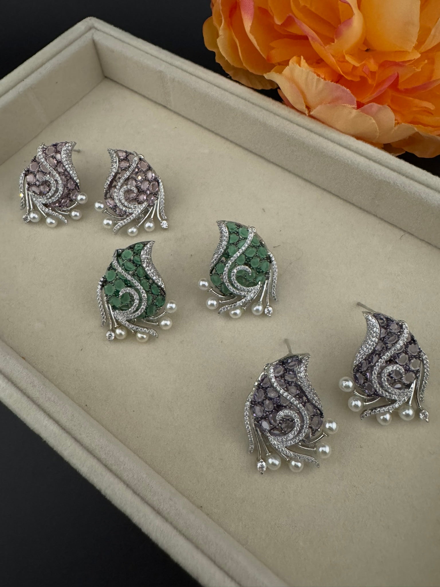 Premium Nano Setting Cubic Zirconia, Crystal stones in Unique setting is designer Inspired Statement Silver colored Stud earrings