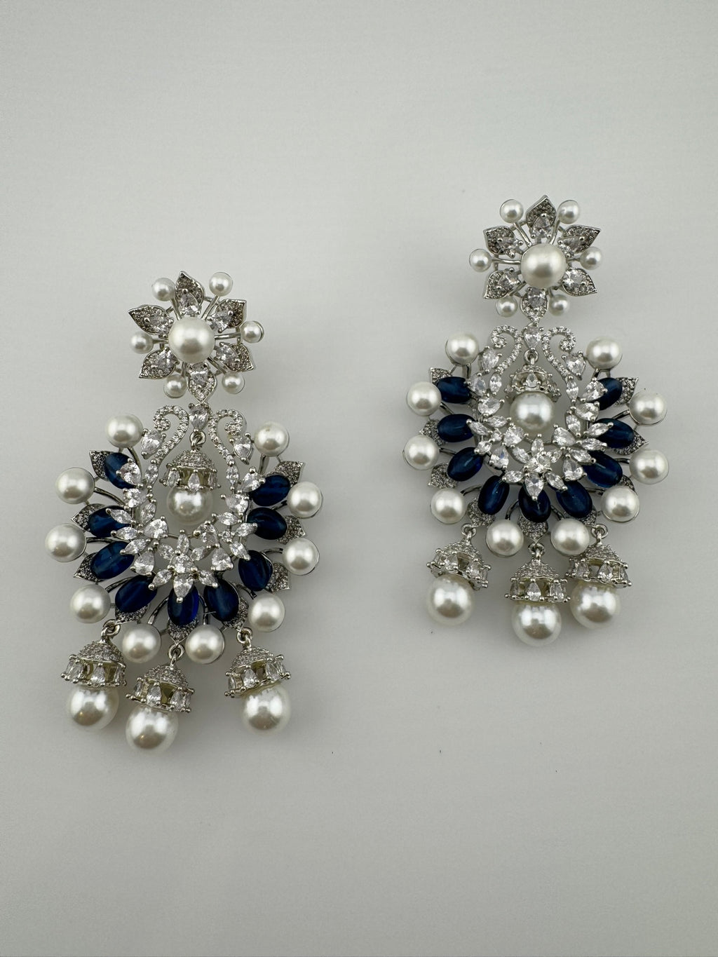 Premium Nano Setting Cubic Zirconia with Blue stones and Pearls is designer Inspired Statement Drop Dangle Long Chandbali earring