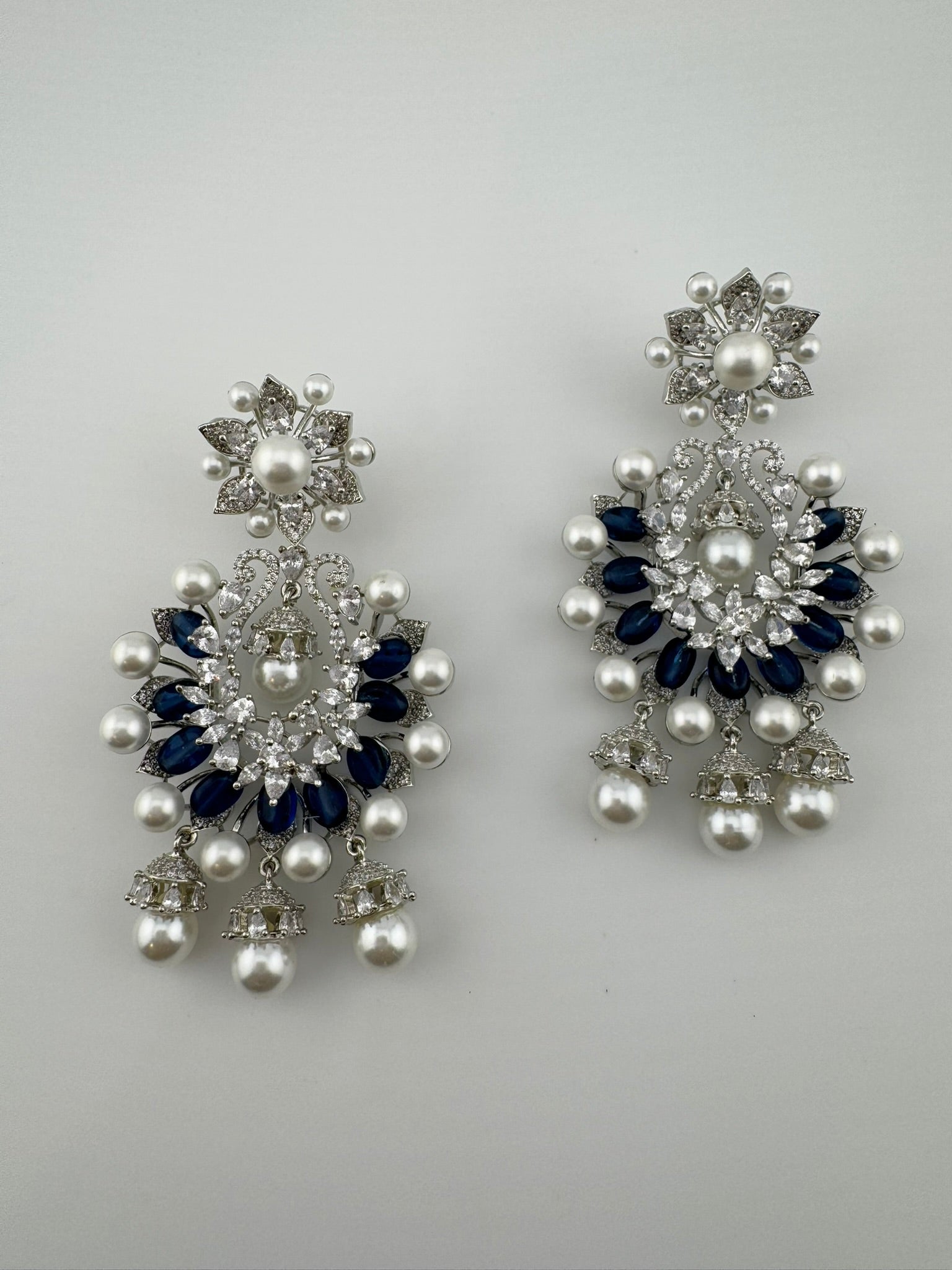 Premium Nano Setting Cubic Zirconia with Blue stones and Pearls is designer Inspired Statement Drop Dangle Long Chandbali earring