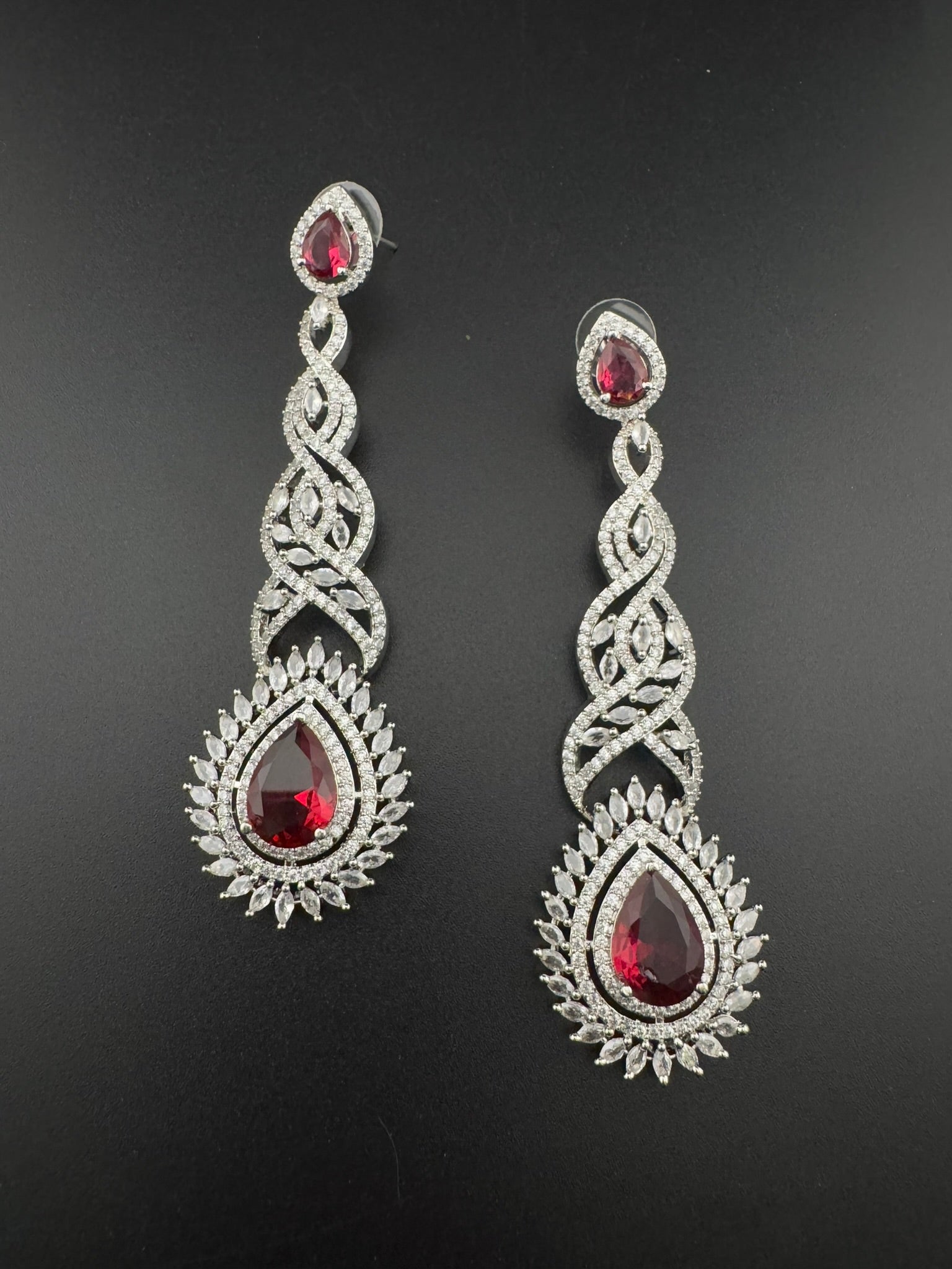 Premium Cubic Zirconia and Crystal stone in silver color is designer Inspired Statement Long earrings