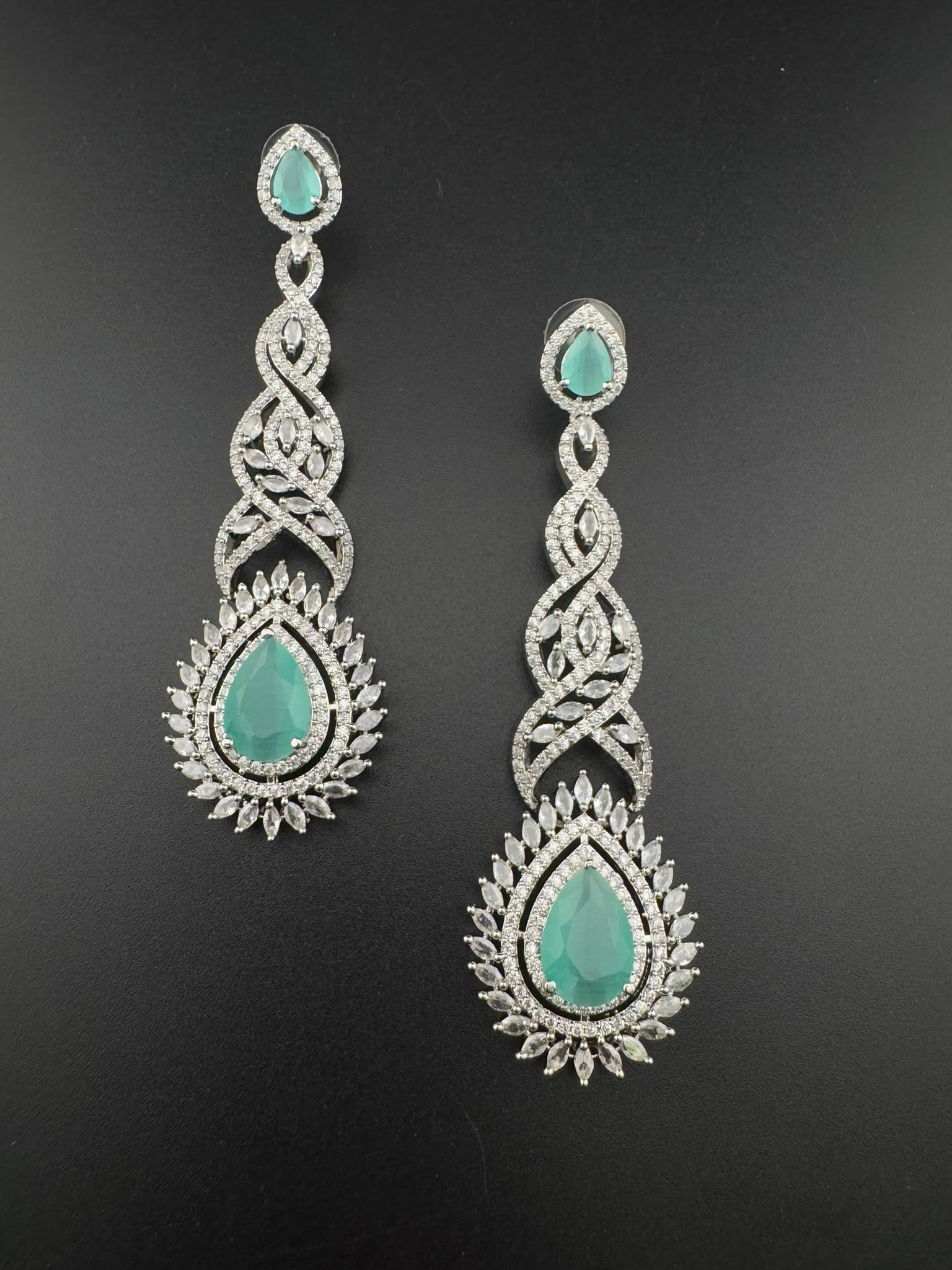 Premium Cubic Zirconia and Crystal stone in silver color is designer Inspired Statement Long earrings