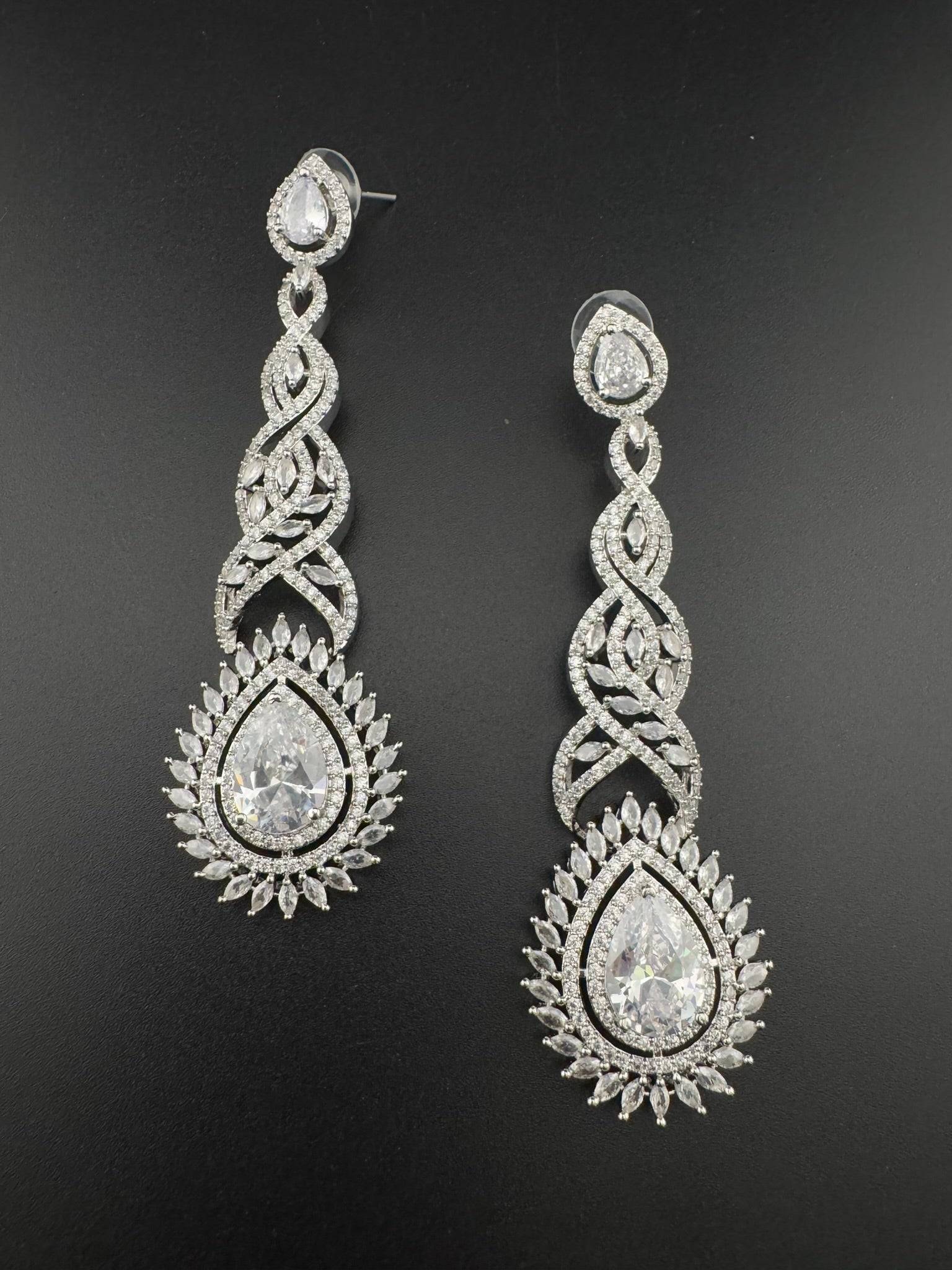 Premium Cubic Zirconia and Crystal stone in silver color is designer Inspired Statement Long earrings