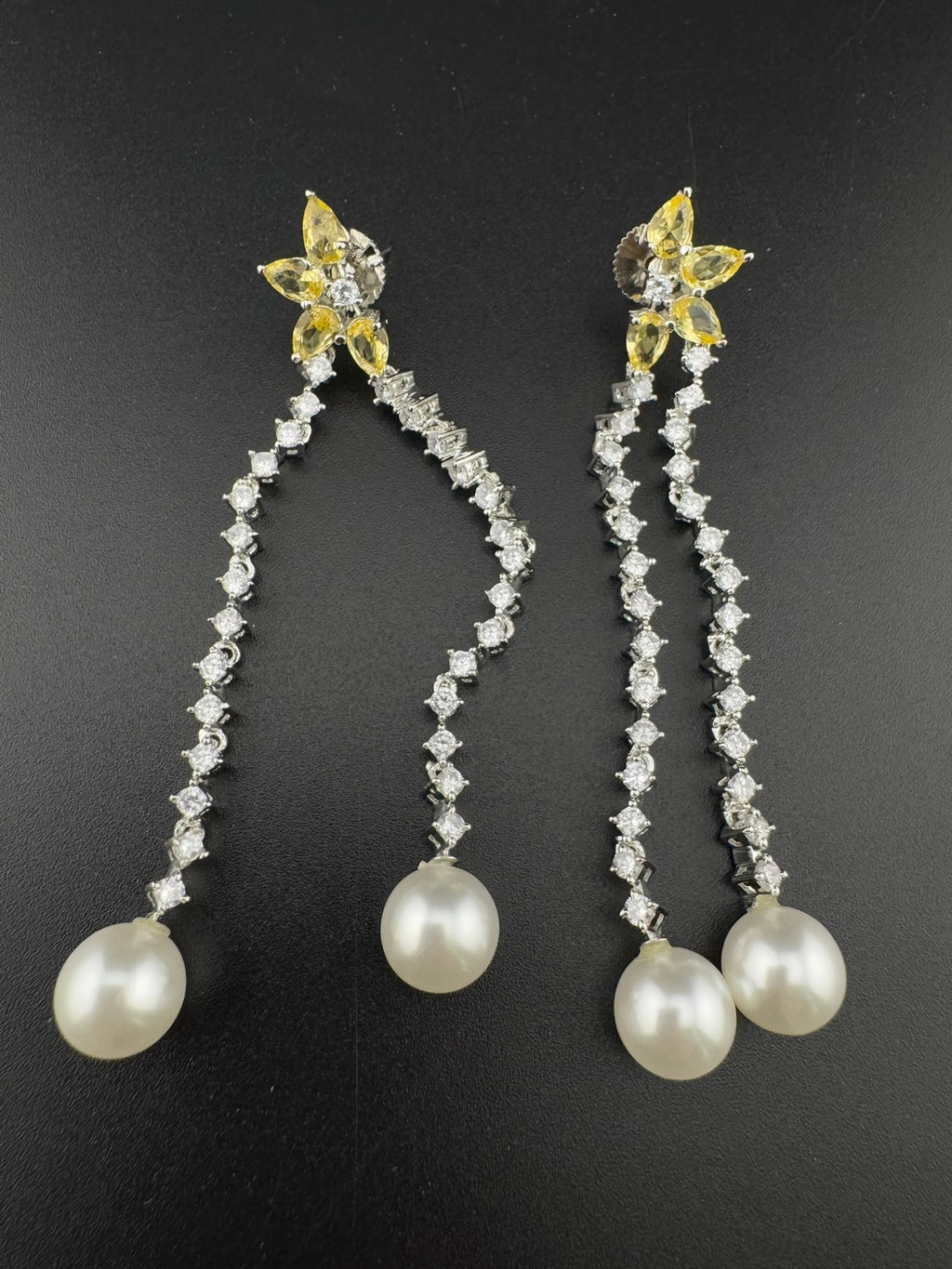 Premium silver color Cubic Zirconia Dangle long earrings with Crystal and Pearls is designer Statement long earrings