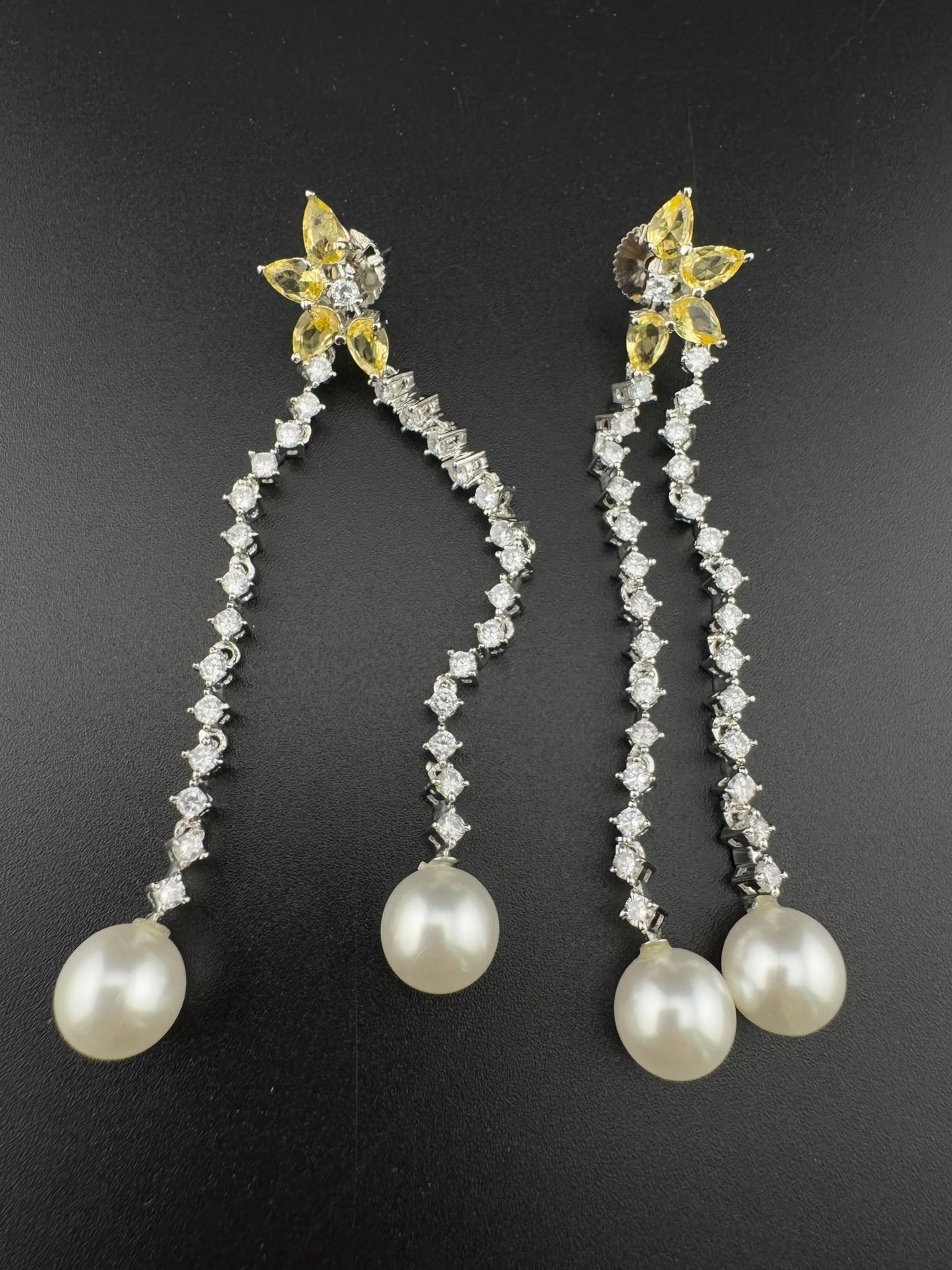 Premium silver color Cubic Zirconia Dangle long earrings with Crystal and Pearls is designer Statement long earrings