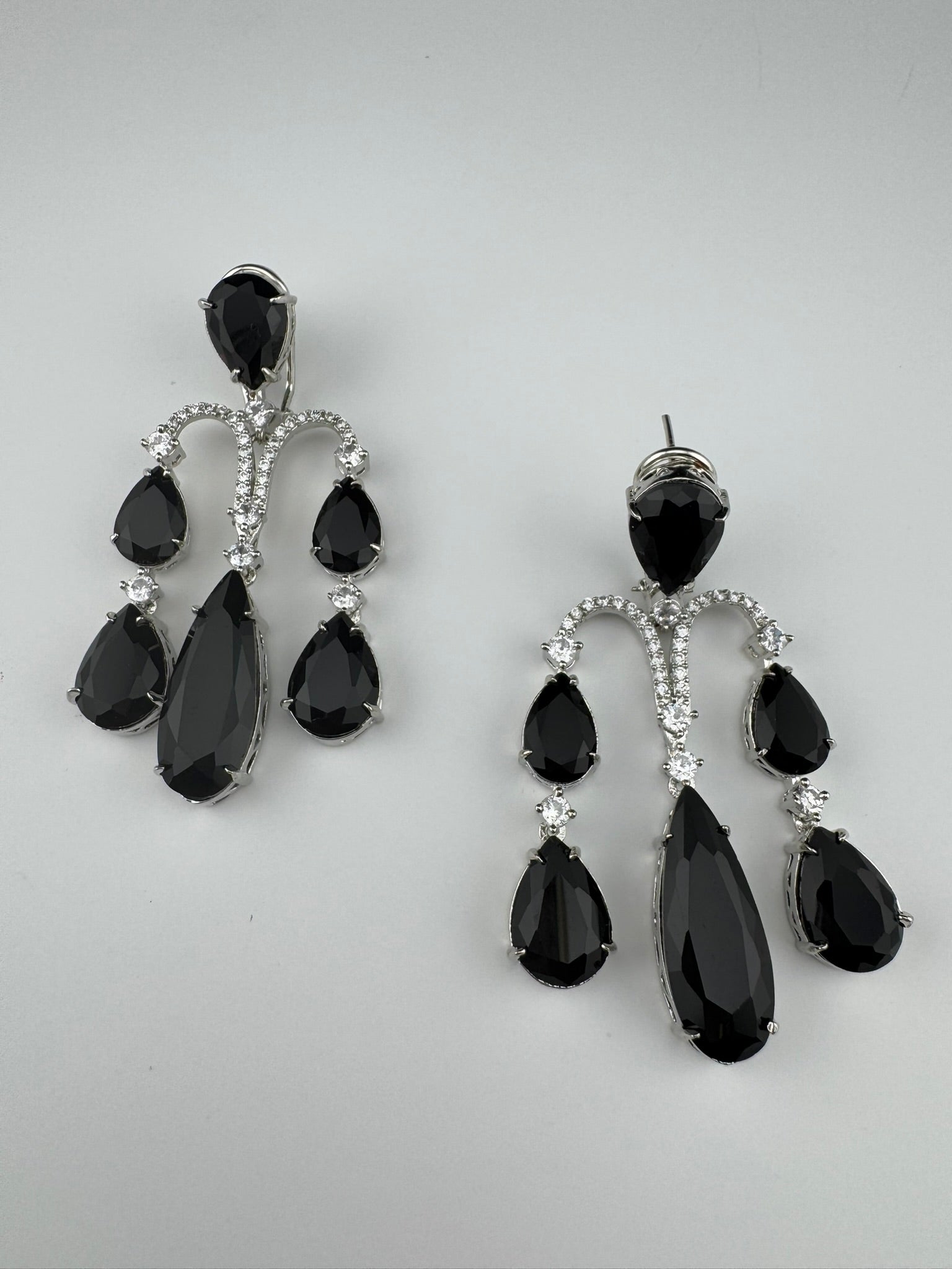 Premium Cubic Zirconia and glass stone in silver color is designer Inspired Statement Long earrings