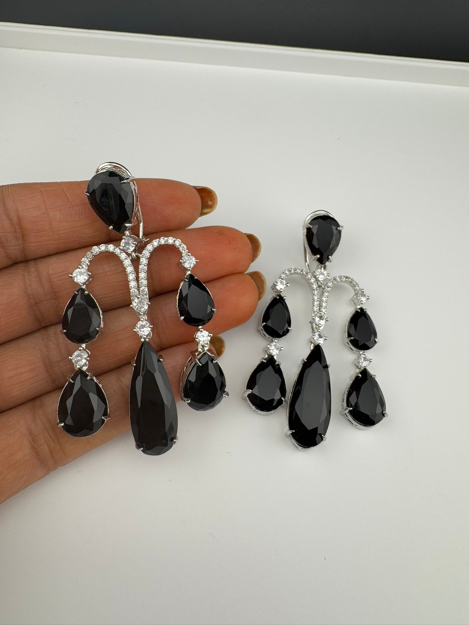 Premium Cubic Zirconia and glass stone in silver color is designer Inspired Statement Long earrings
