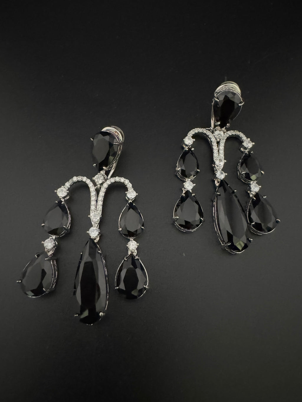 Premium Cubic Zirconia and glass stone in silver color is designer Inspired Statement Long earrings