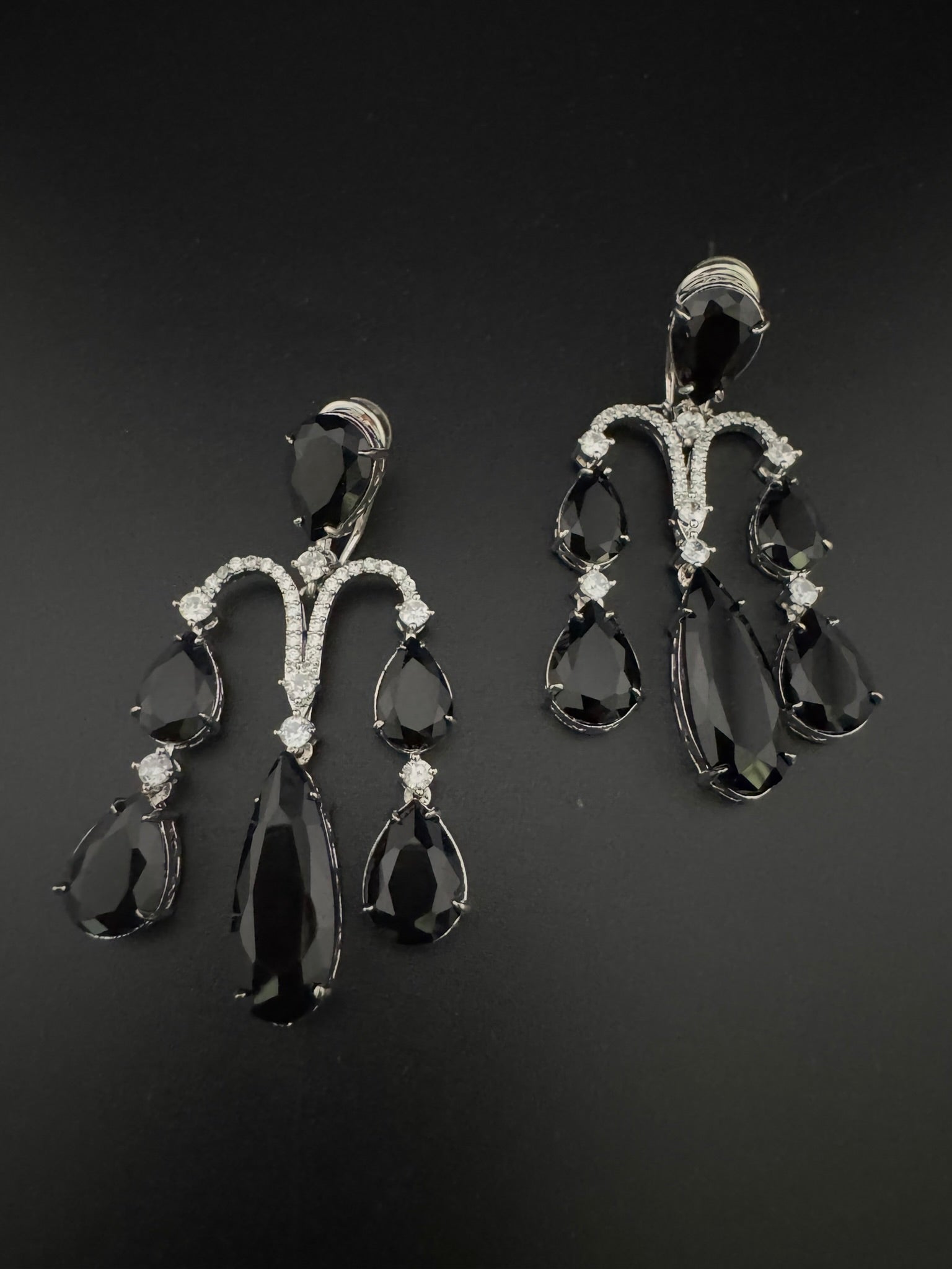 Premium Cubic Zirconia and glass stone in silver color is designer Inspired Statement Long earrings