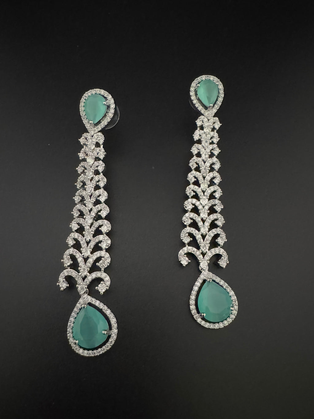 Premium Cubic Zirconia and Crystal stone in silver color is designer Inspired Statement Long earrings