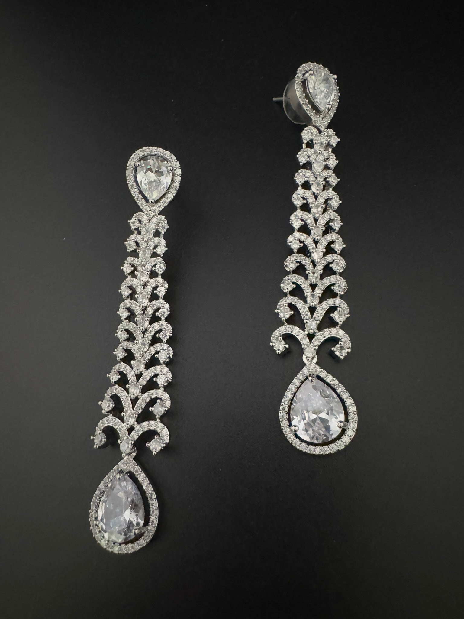 Premium Cubic Zirconia and Crystal stone in silver color is designer Inspired Statement Long earrings