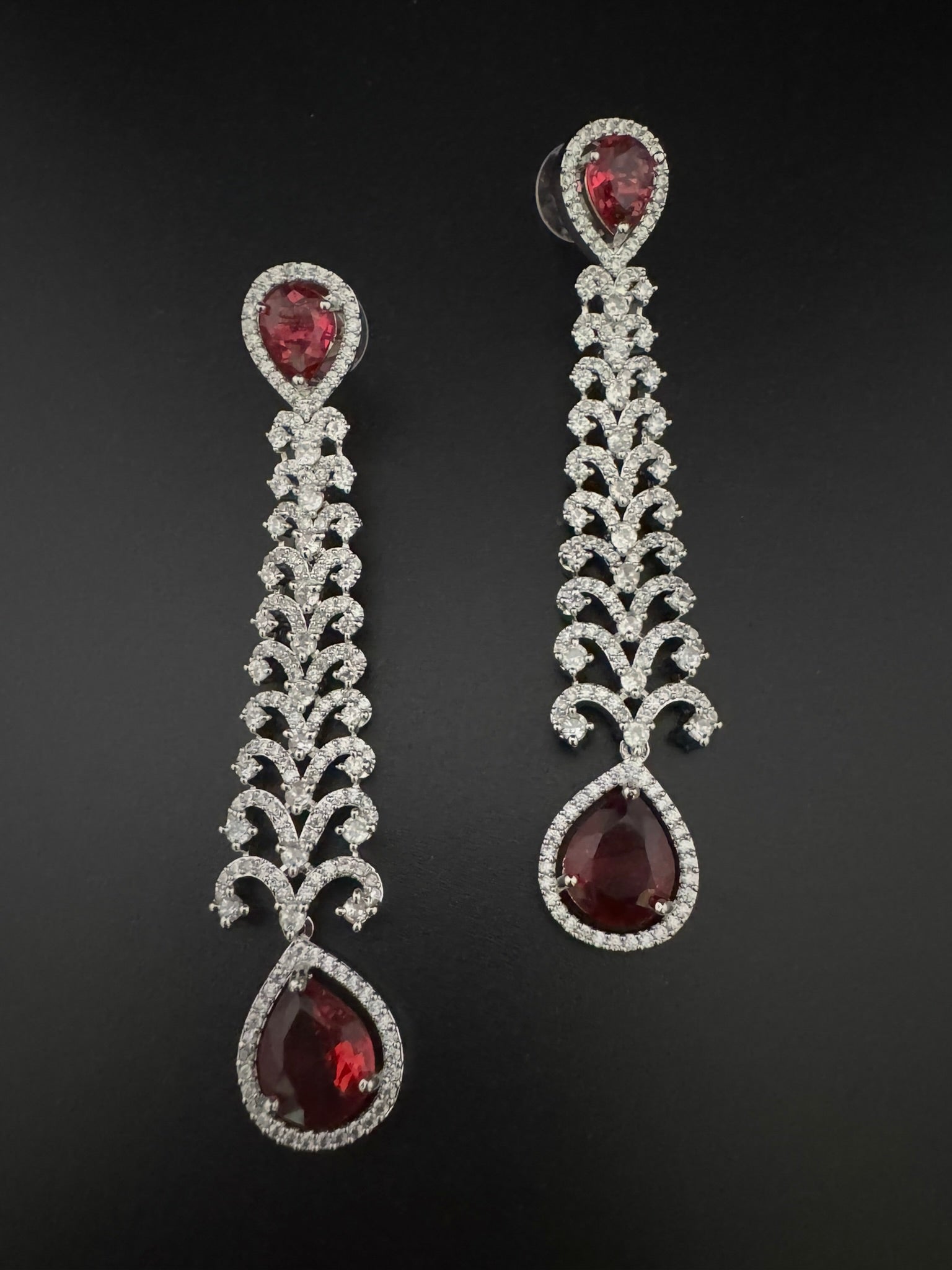 Premium Cubic Zirconia and Crystal stone in silver color is designer Inspired Statement Long earrings