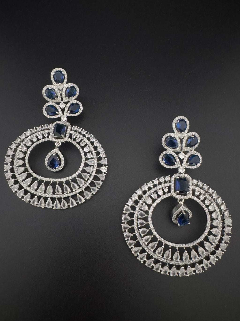 Premium Cubic Zirconia Oversized Chandelier earrings in stones in silver color is designer Inspired Long Statement earrings