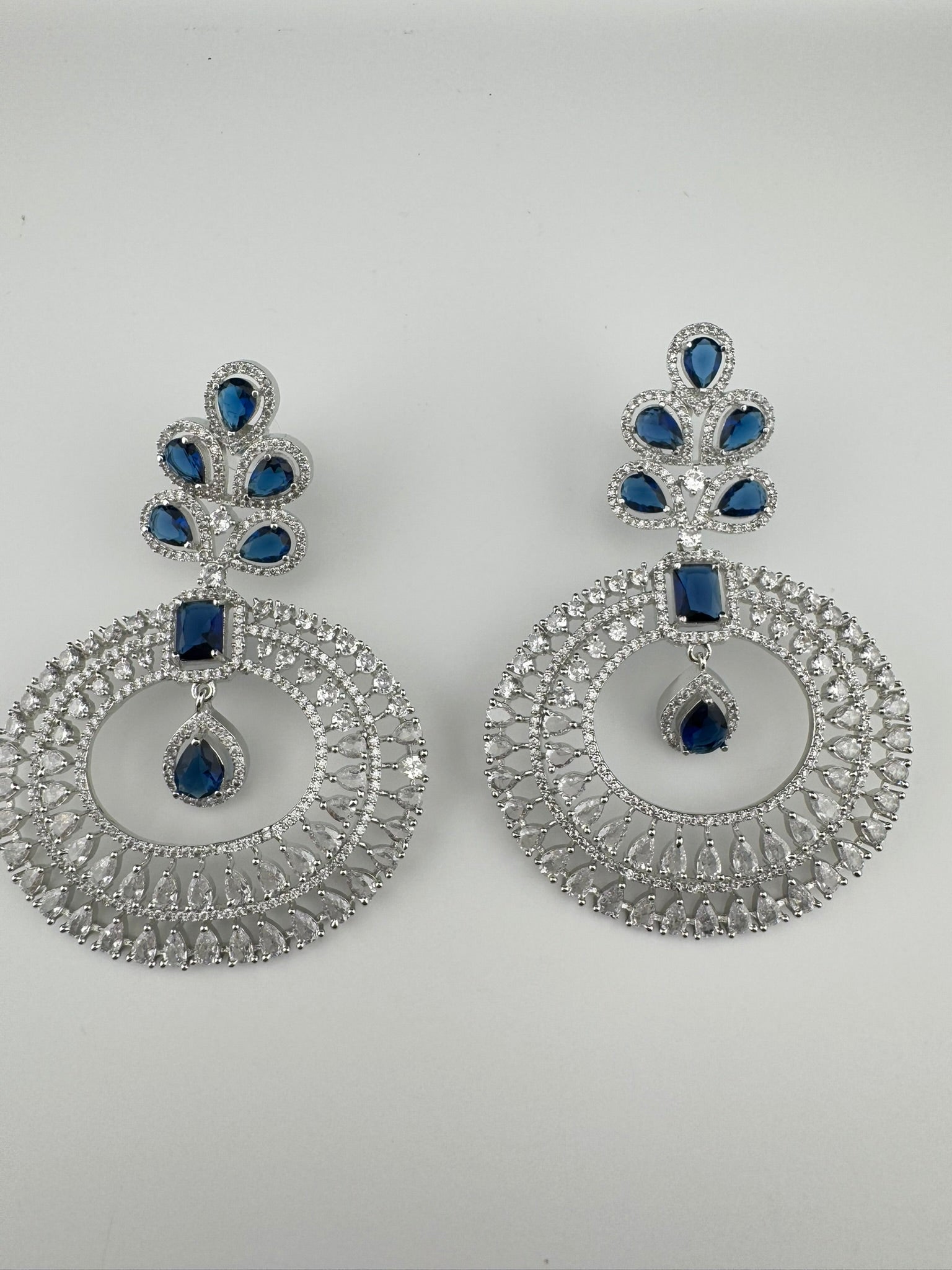 Premium Cubic Zirconia Oversized Chandelier earrings in stones in silver color is designer Inspired Long Statement earrings