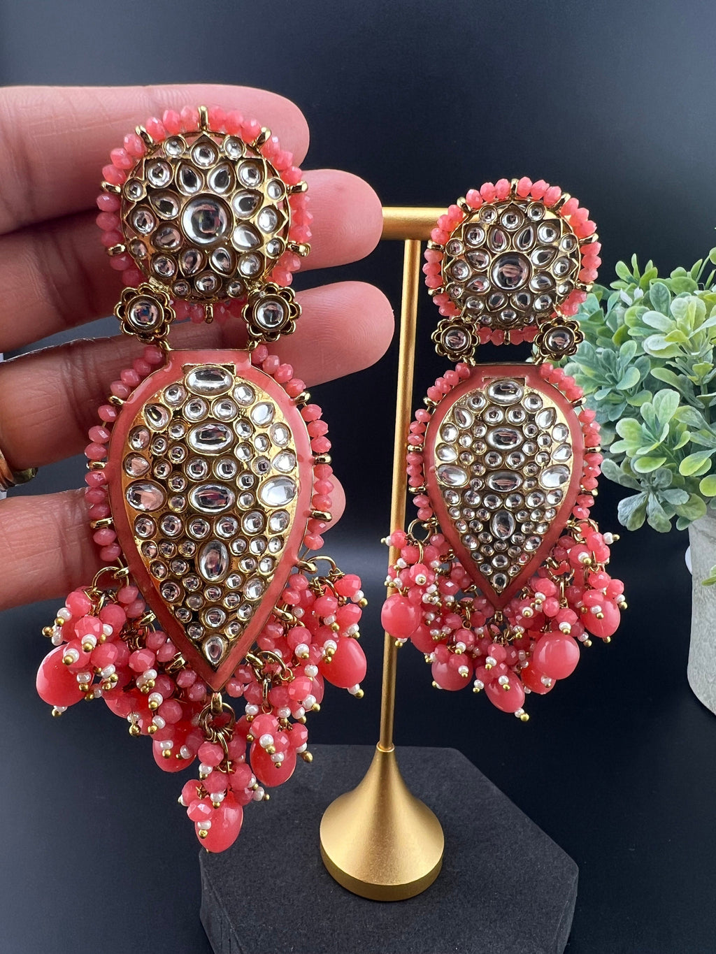 Exquisite detailed Gold and Coral color long Chand Bali Earrings with kundan and pearls